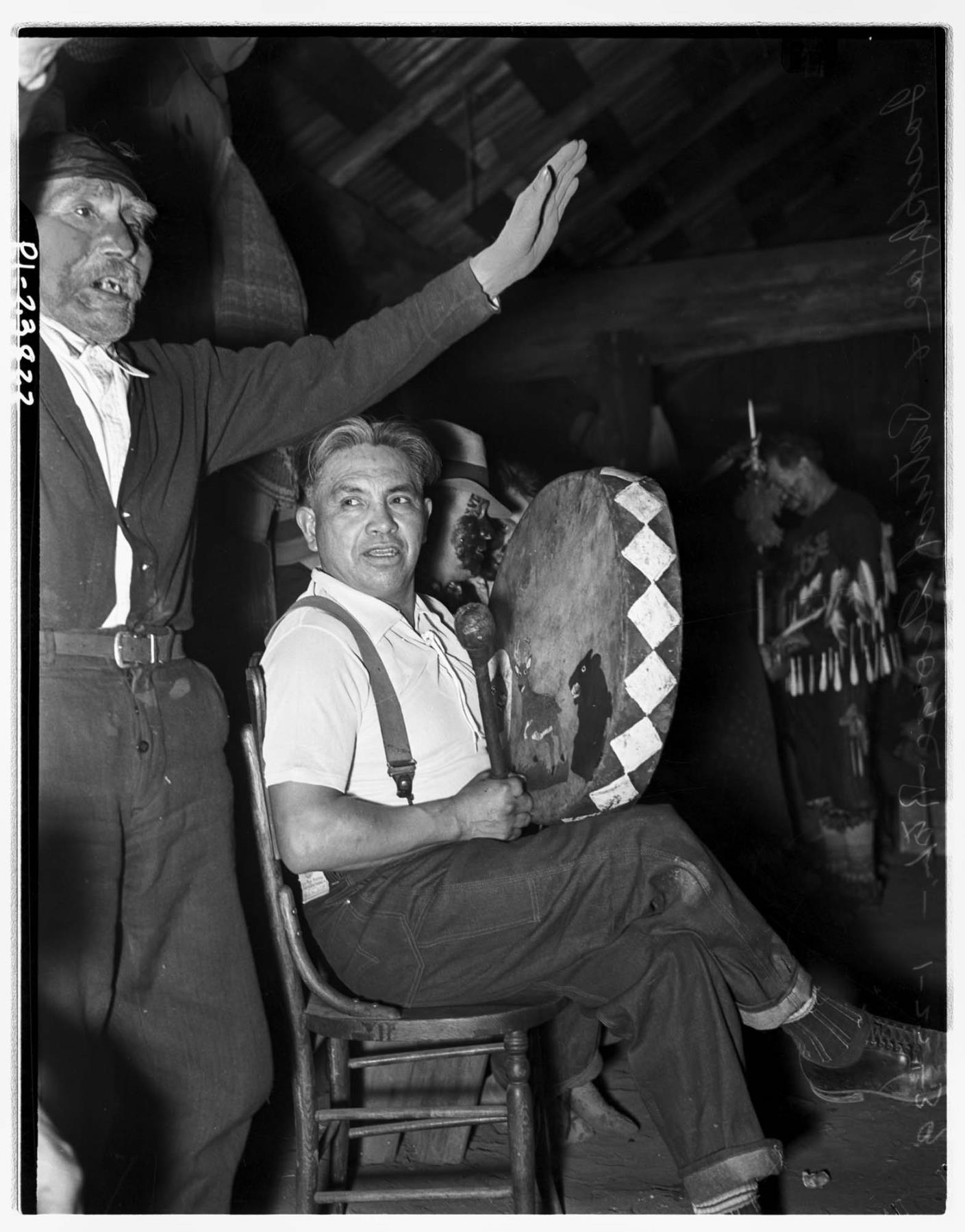 Image of Swinomish drummer and singer at the Treaty Day observance, January 22, 1939
