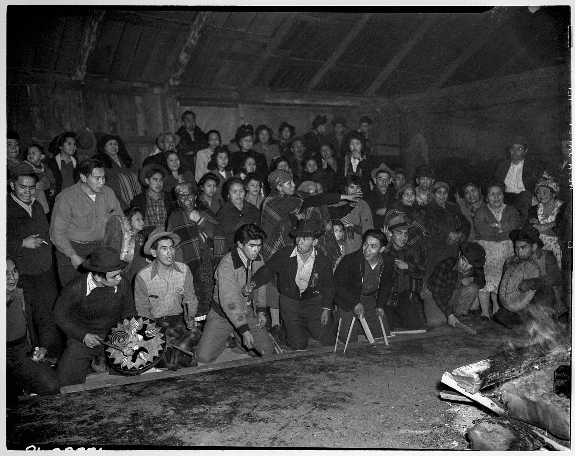 Image of Slahal game at the Swinomish smokehouse, January 22, 1946