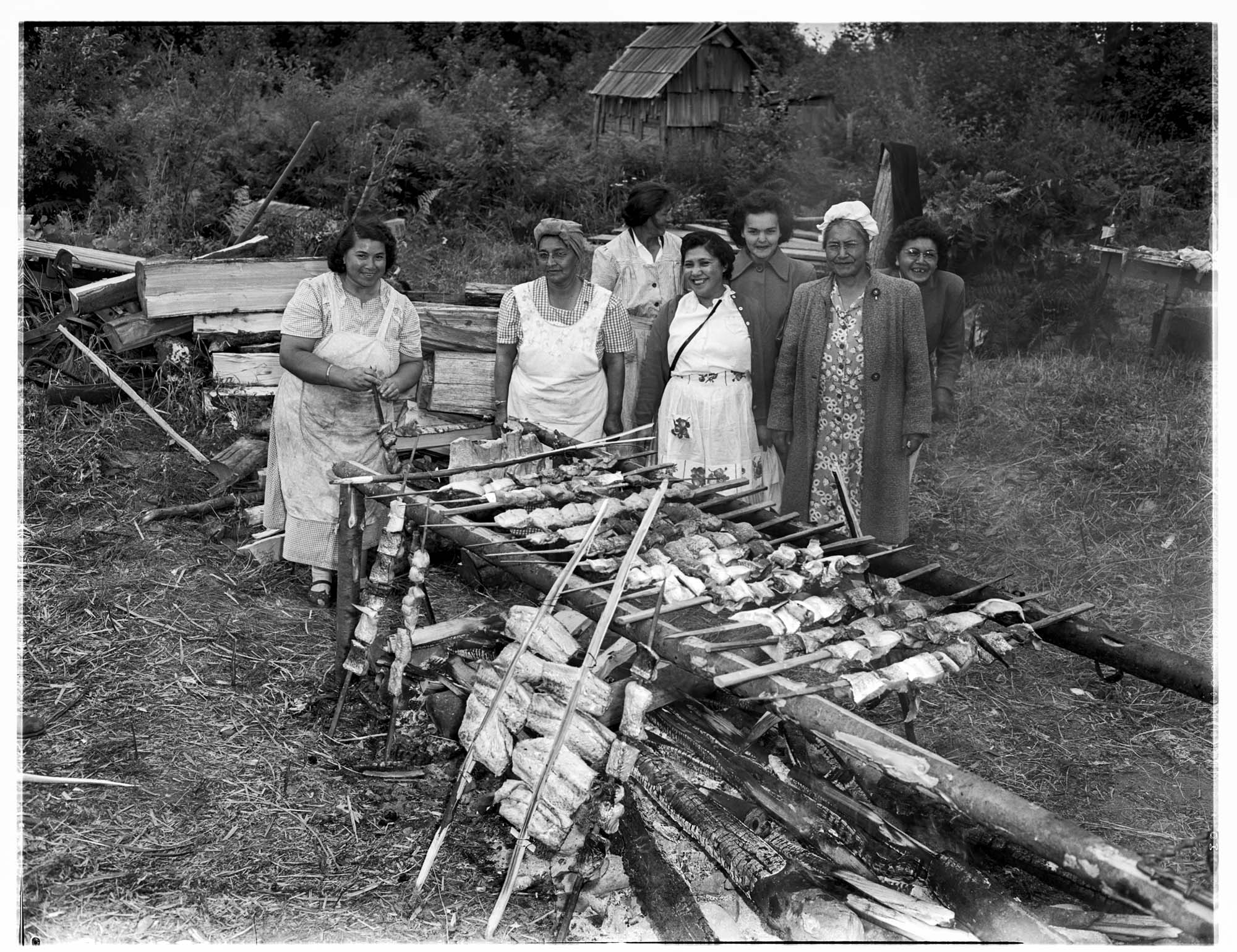 Image of Women cooking salmon, Muckleshoot Reservation, circa 1950