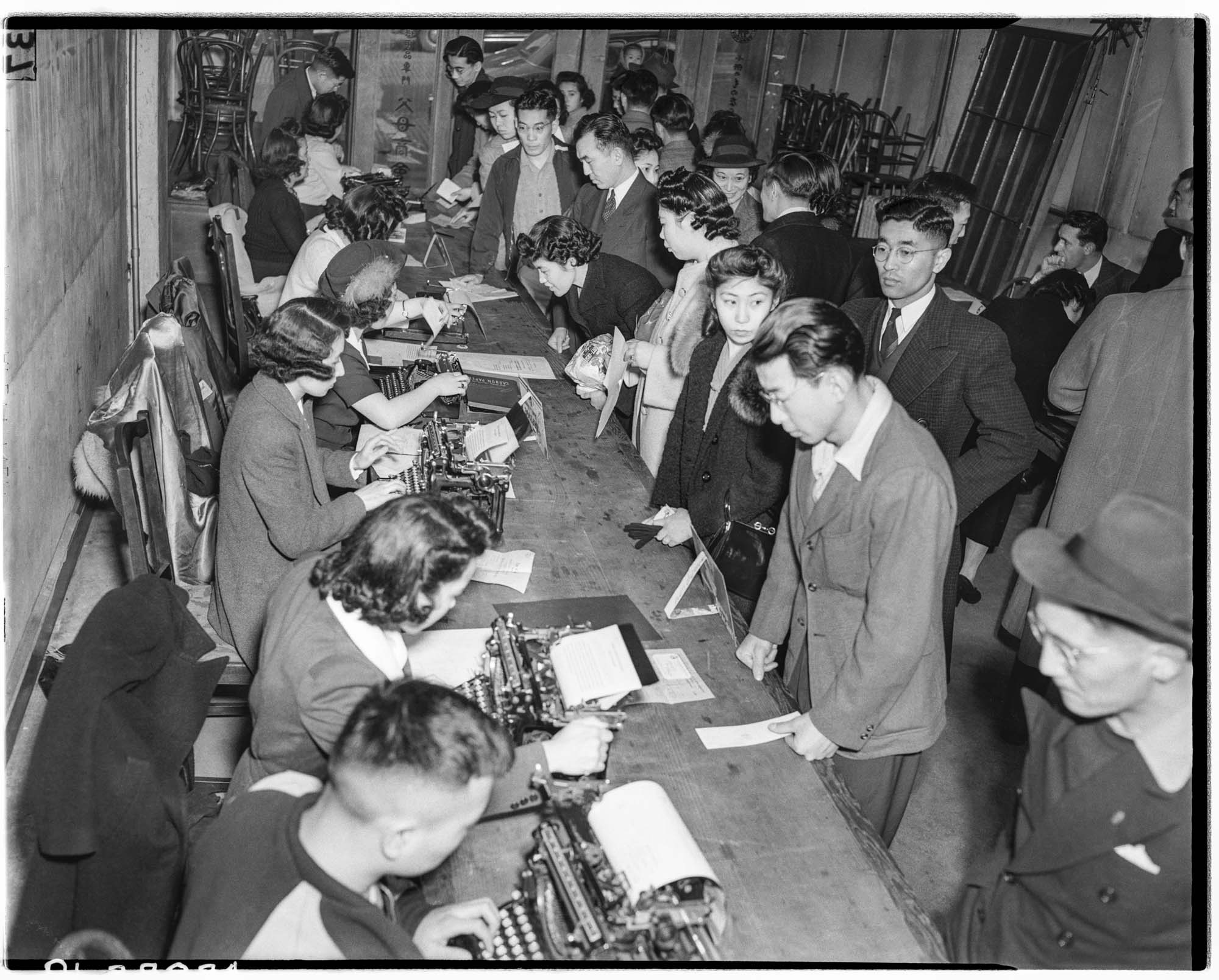 Image of Japanese Americans registering for exclusion, Seattle, 1942
