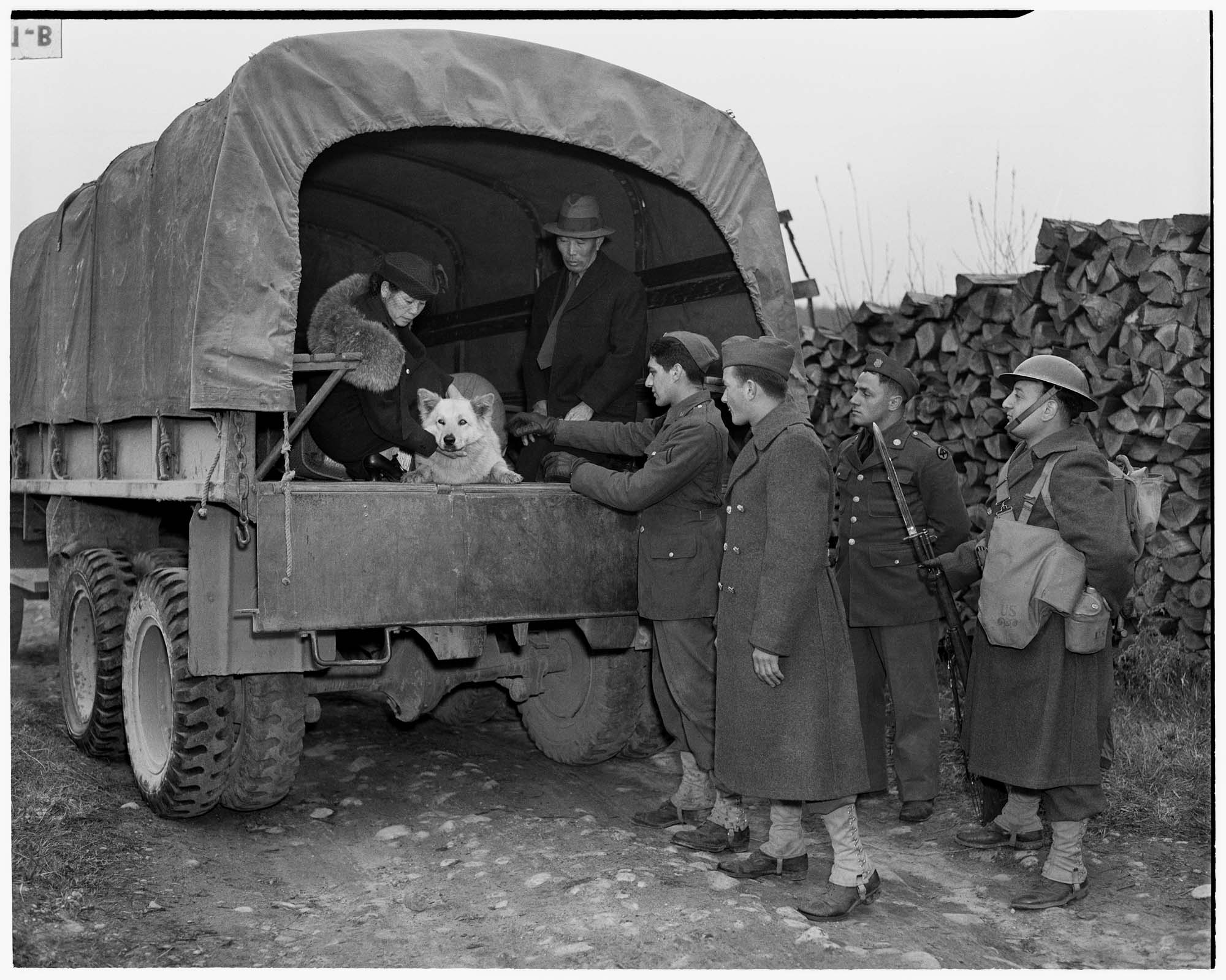 Image of Mr. and Mrs. Moji in back of military truck, March 30, 1942