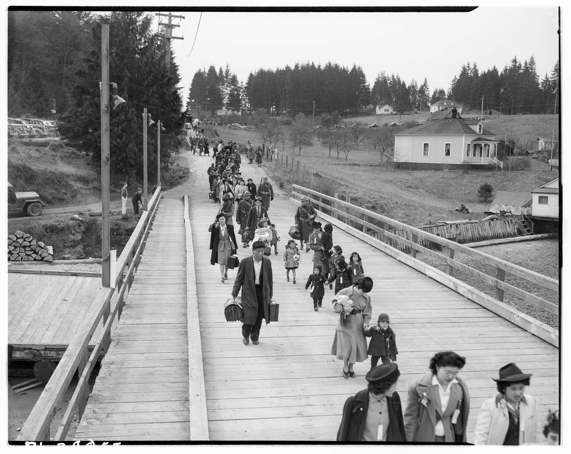 Image of Japanese American families leaving Bainbridge Island, March 31, 1942
