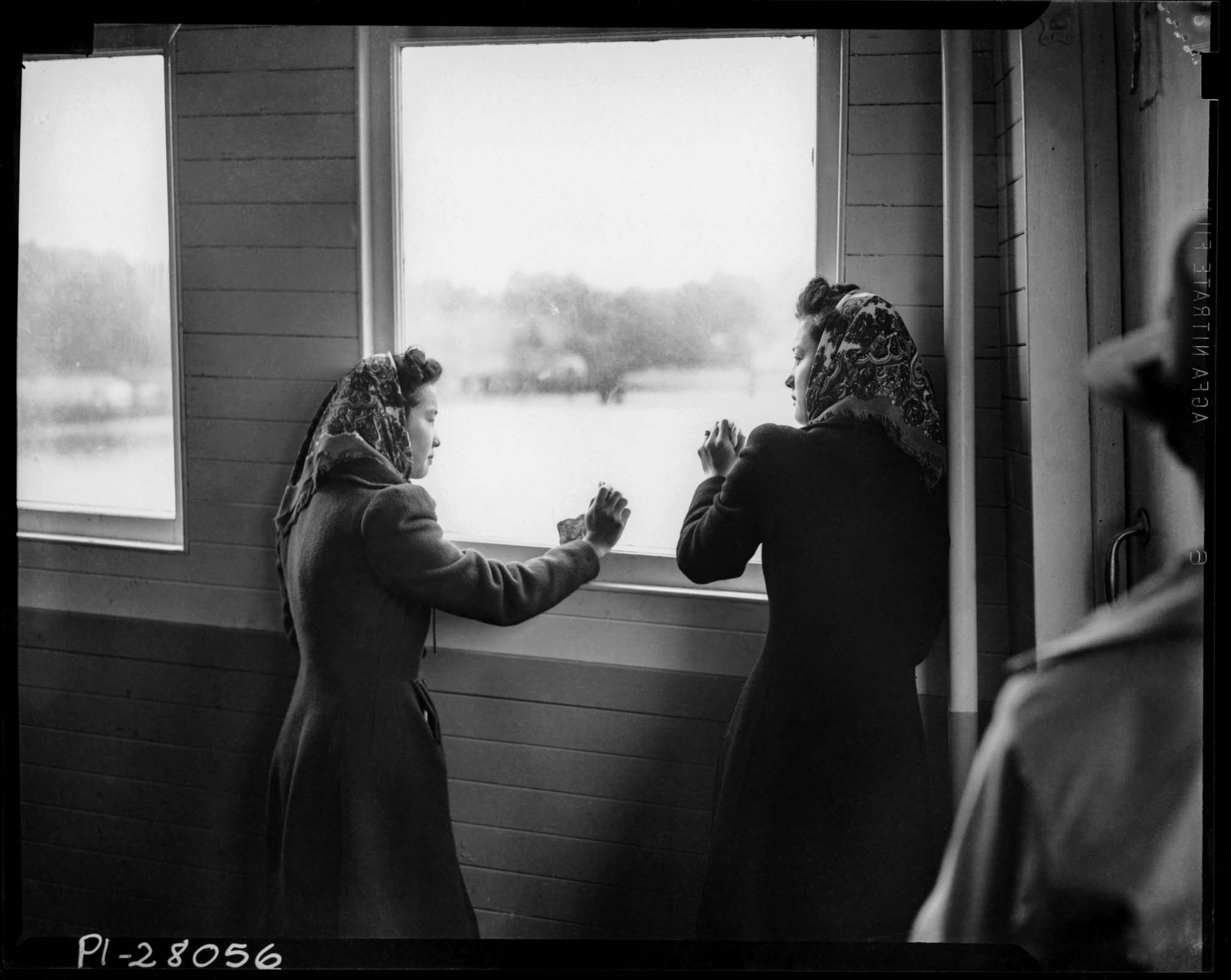 Image of Ritsuko Terayama and Sumiko Furuta at window of ferry crossing Puget Sound, 1942