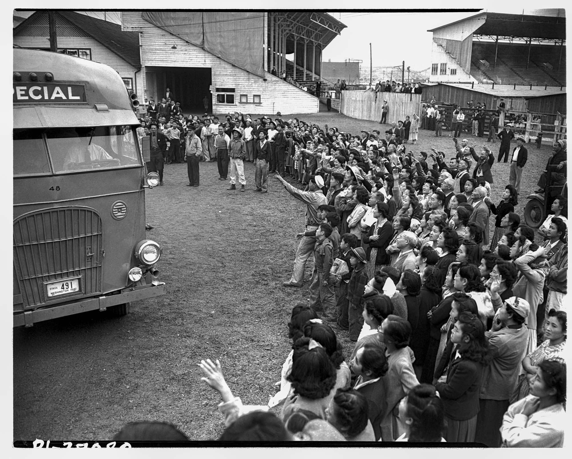 Image of Japanese Americans leaving the Puyallup Assembly Center for incarceation, ca. August 9, 1942.
