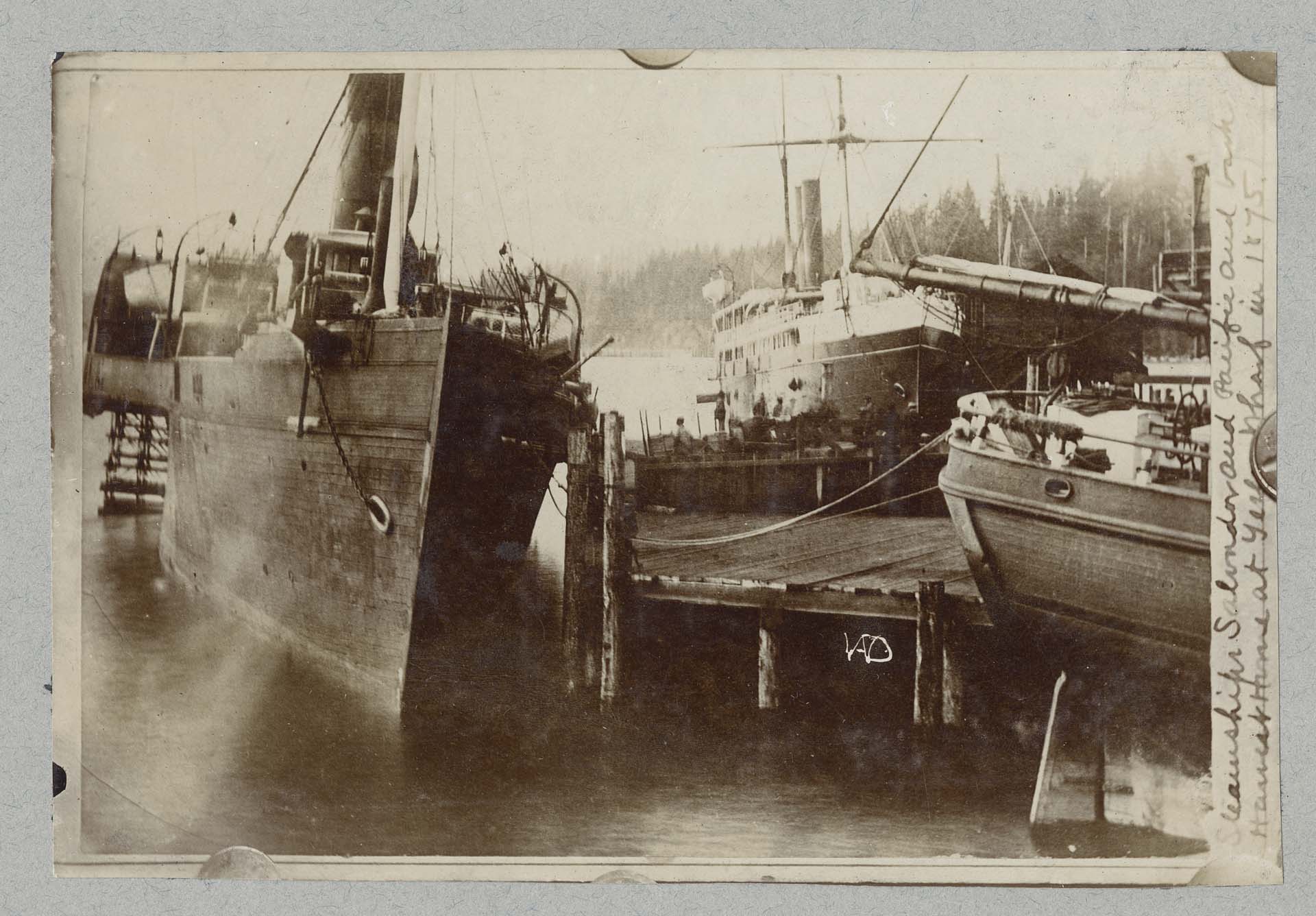 Image of SS Pacific, SS San Salvador, and bark Harriet Hunt docked at Yesler's Wharf, Seattle, 1875