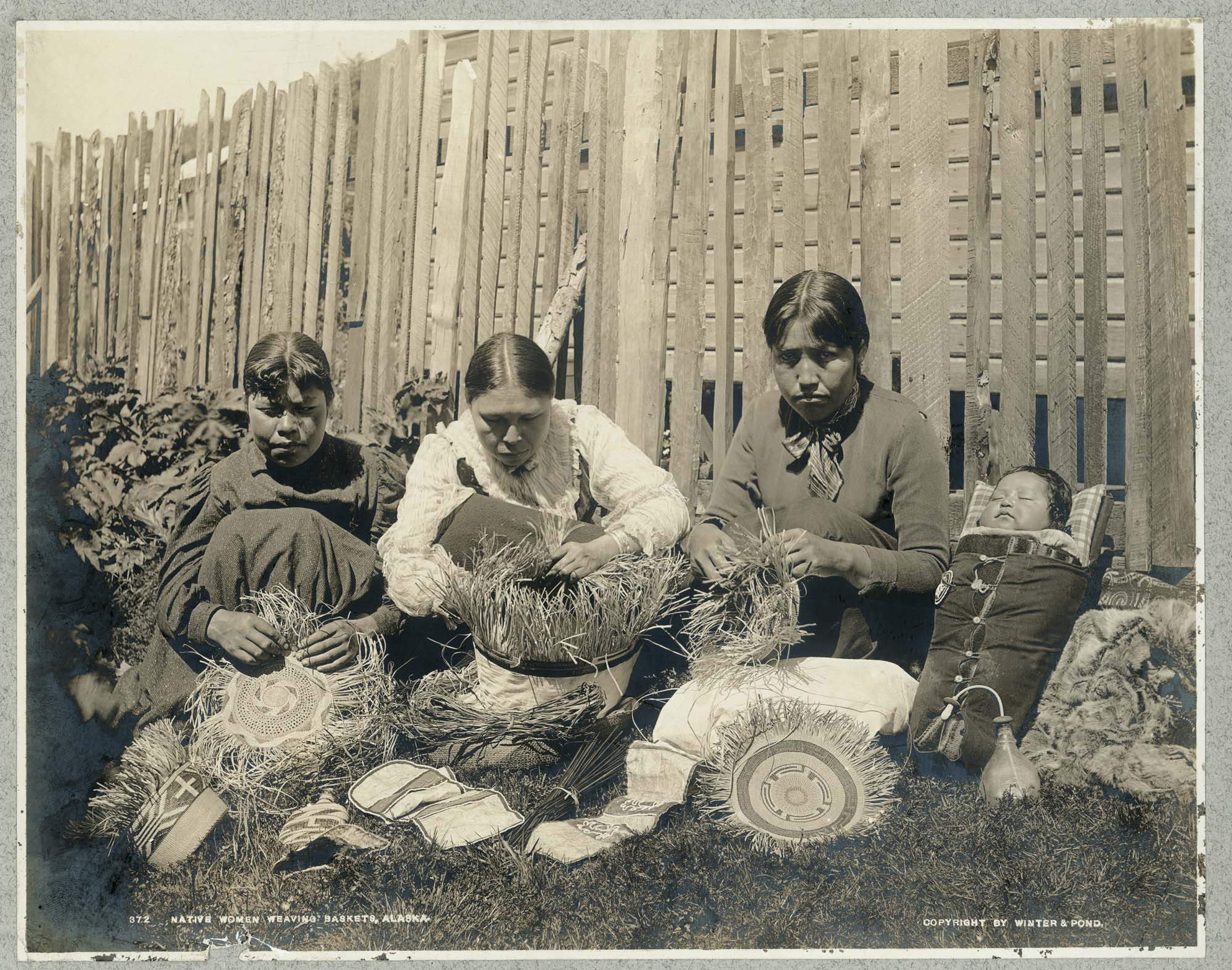 Image of Tlingit women weaving baskets, Alaska, circa 1897