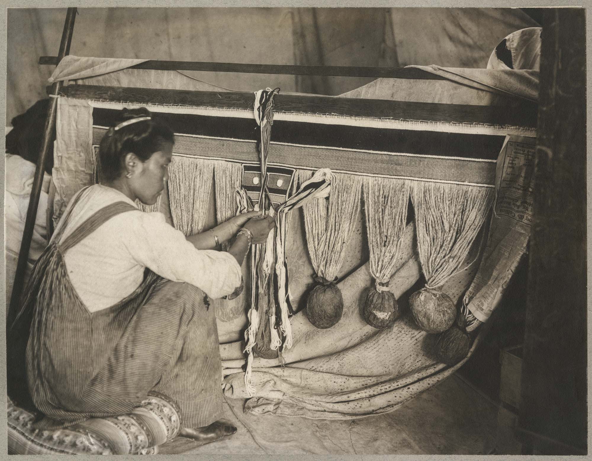 Image of Woman weaving a Chilkat blanket, Alaska, circa 1904