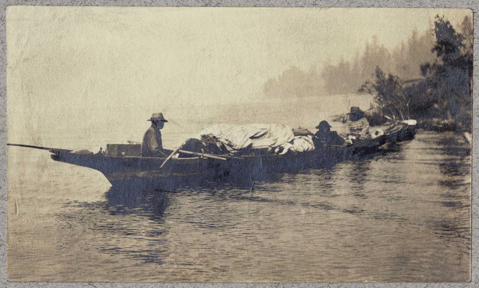 Image of Chesheeahud and others in a canoe on Lake Union, Seattle, circa 1885