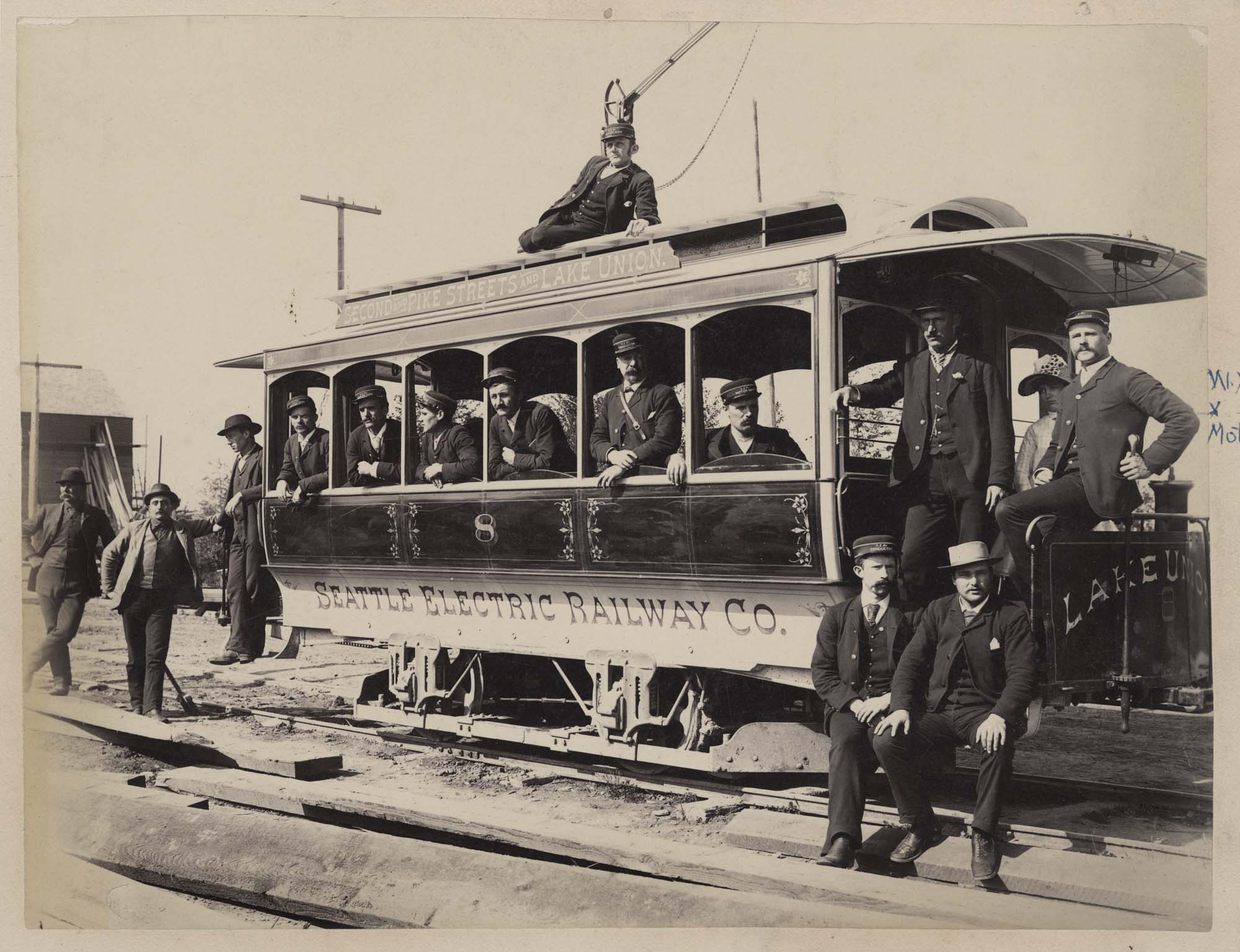 Image of Seattle Electric Railway Company trolley with motormen, circa 1890