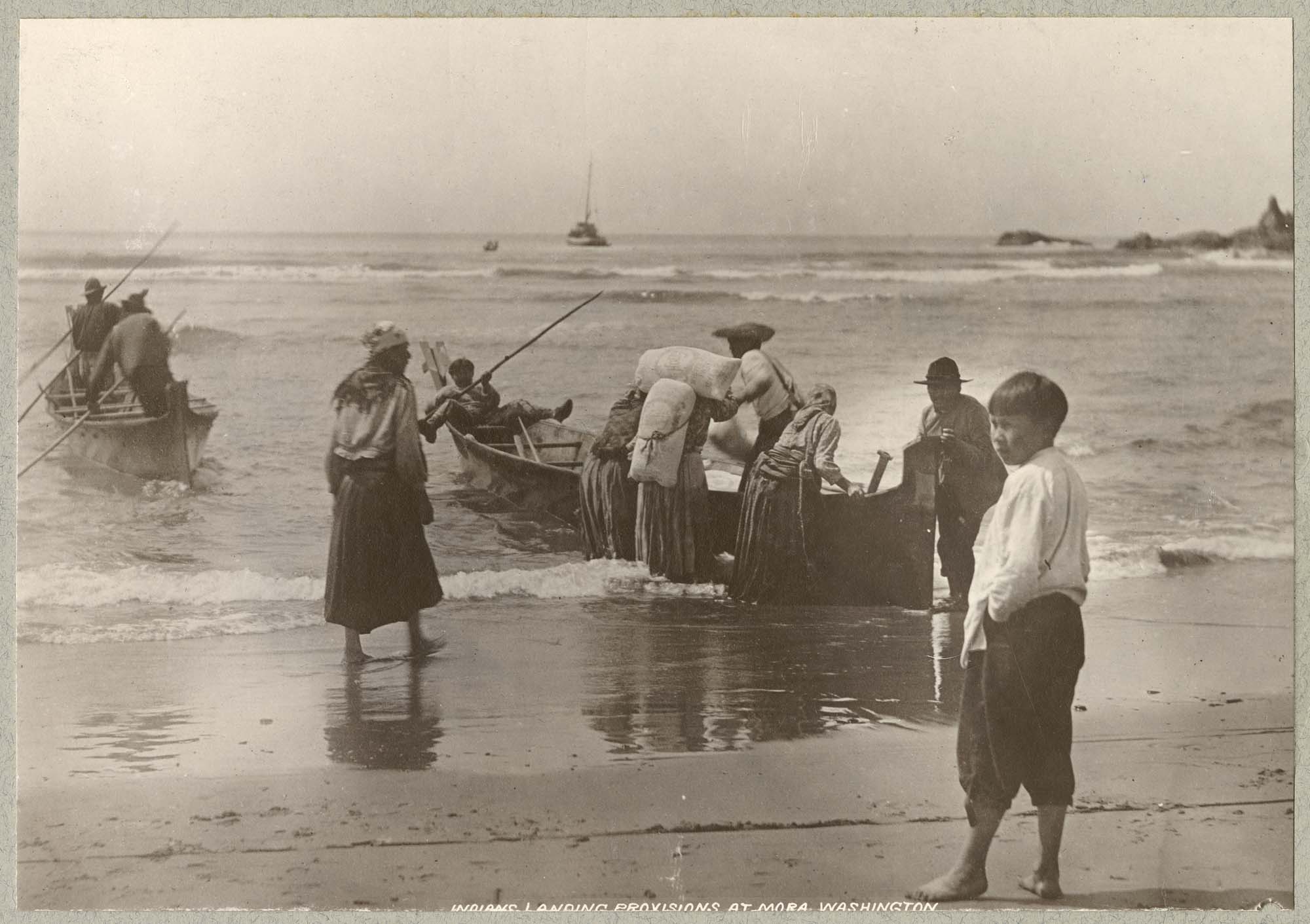 Image of Quileutes landing provisions at La Push, circa 1900