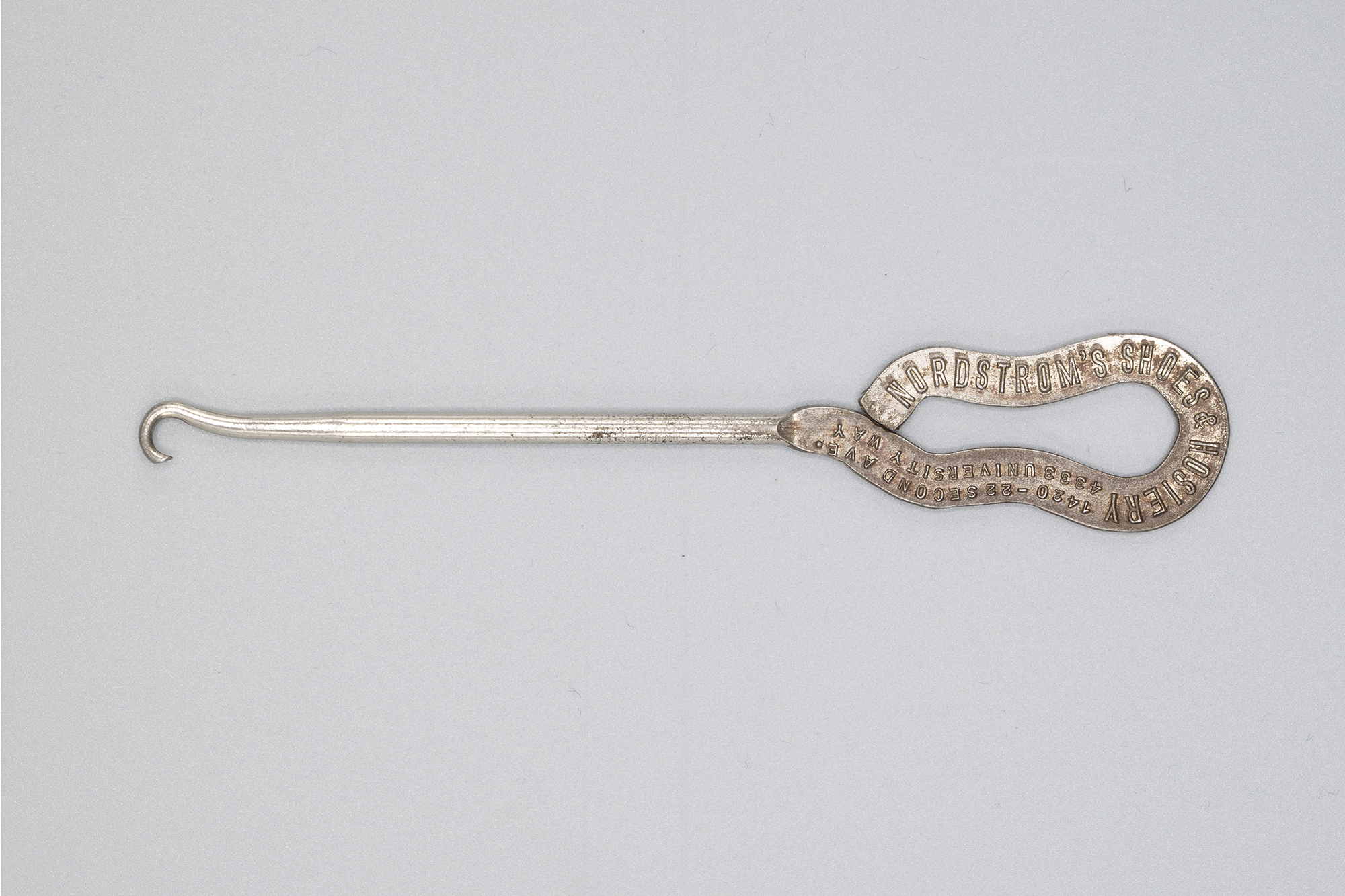 Image of Buttonhook from Nordstrom's shoe store, ca. 1900