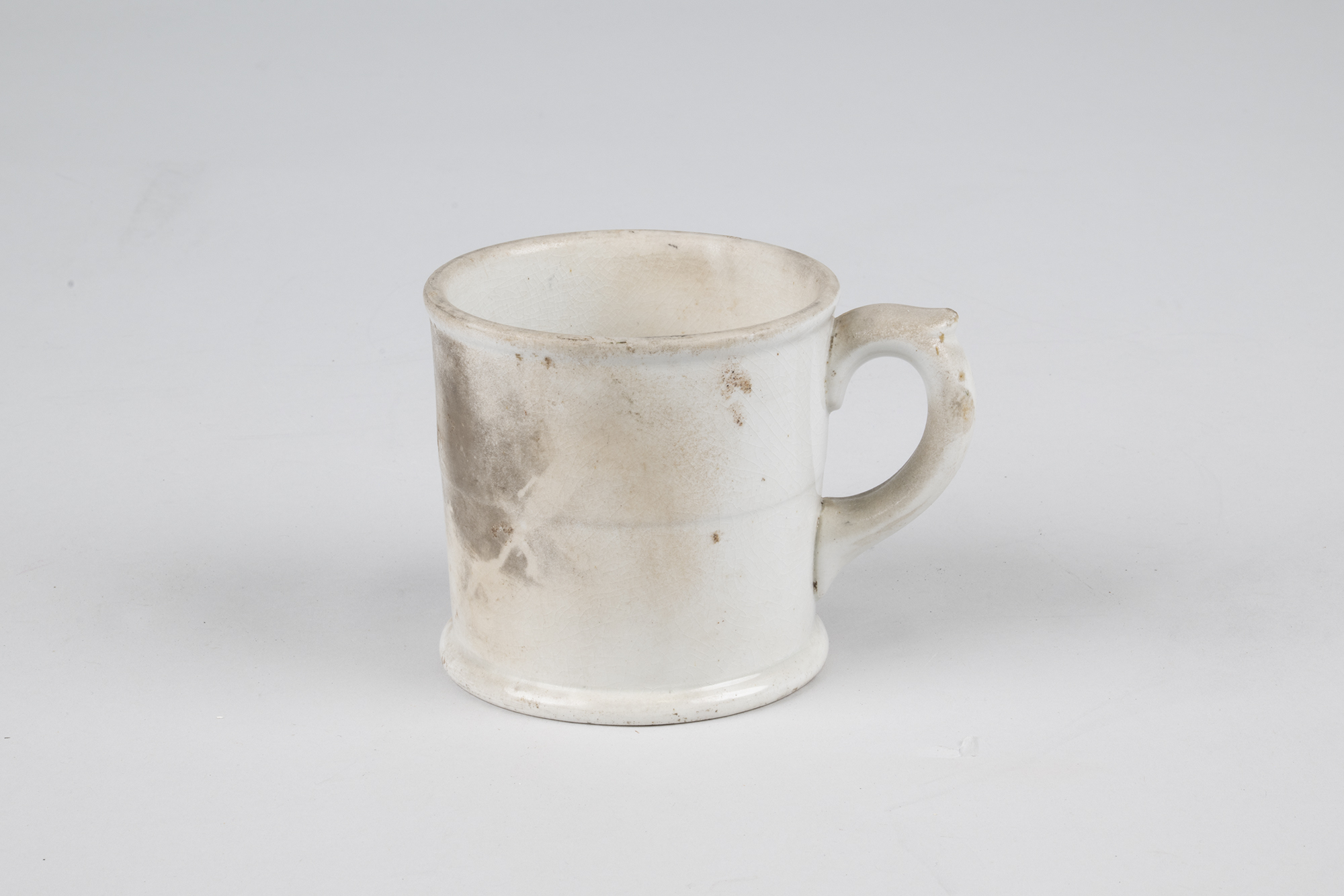 Image of White china coffee mug that burned in the Seattle Fire of 1889