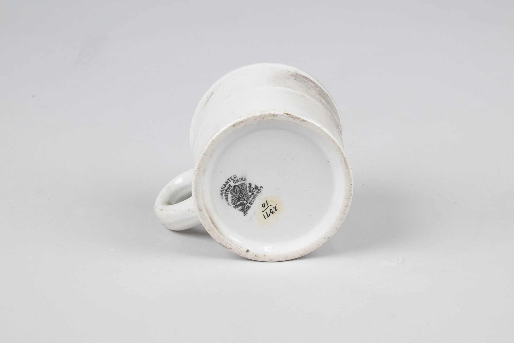 Image of White china coffee mug that burned in the Seattle Fire of 1889