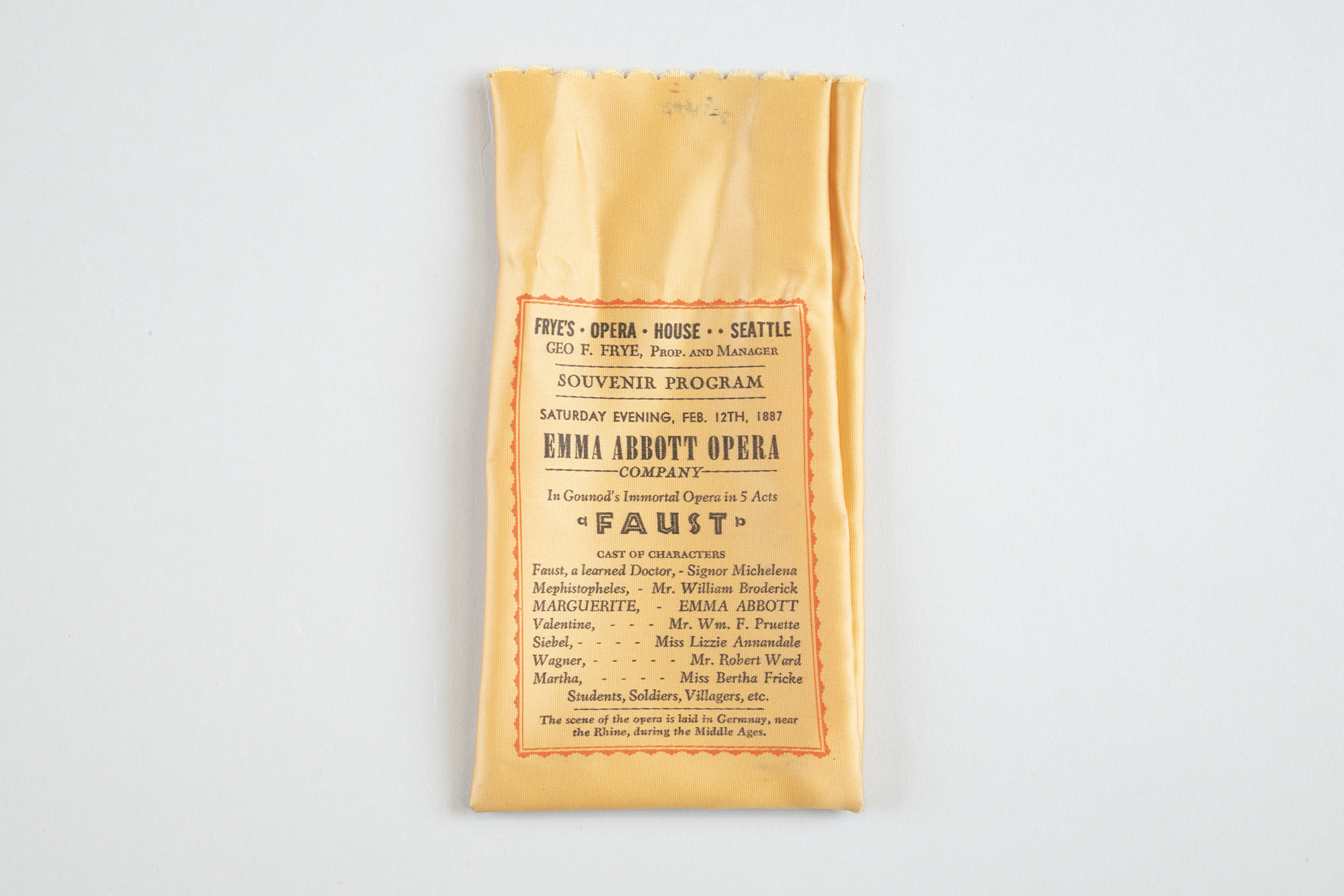 Image of Silk souvenir bag with program from 1962 production of “Aida,” and reprint of program from 1887 “Faust”