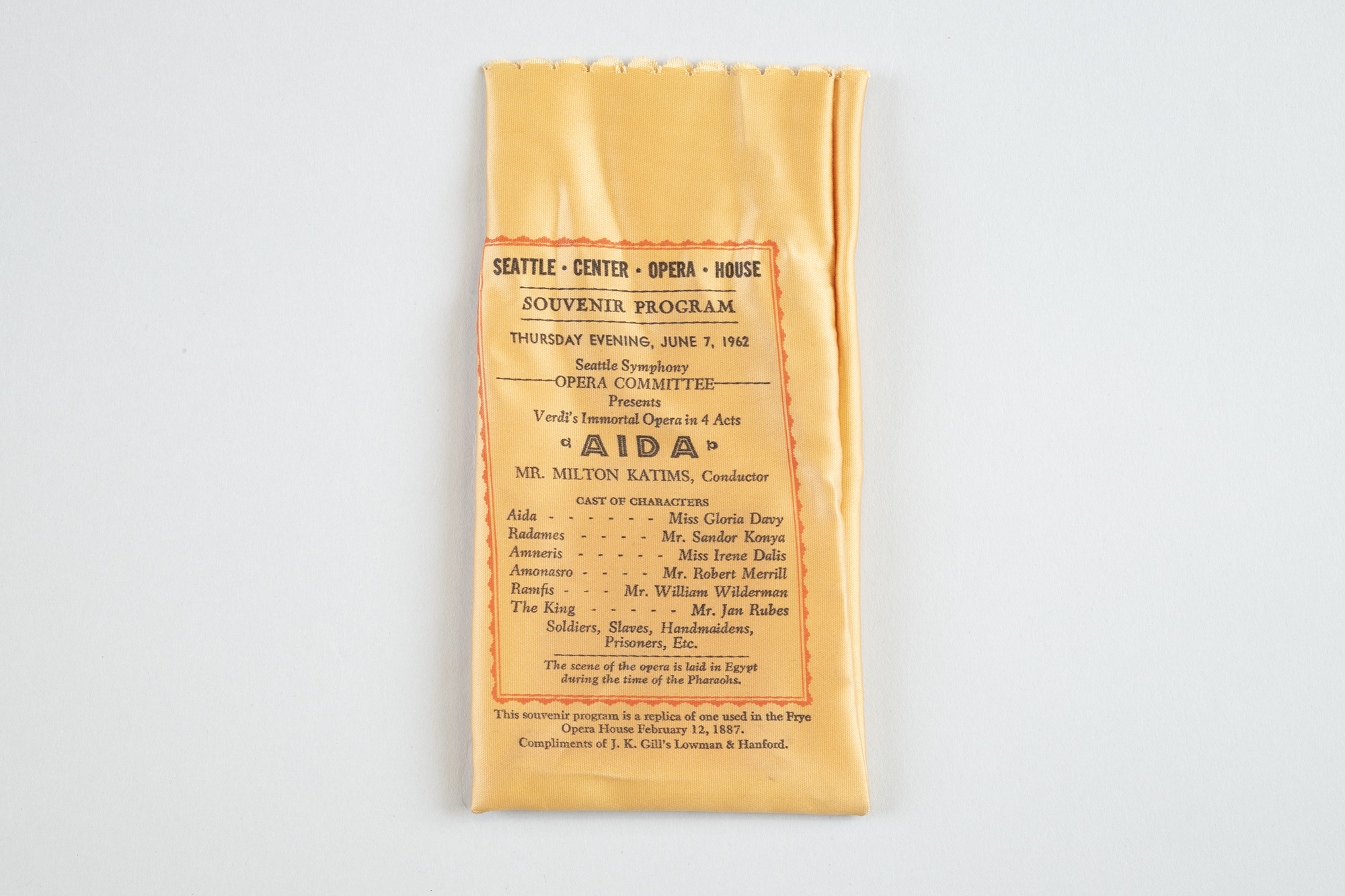 Image of Silk souvenir bag with program from 1962 production of “Aida,” and reprint of program from 1887 “Faust”