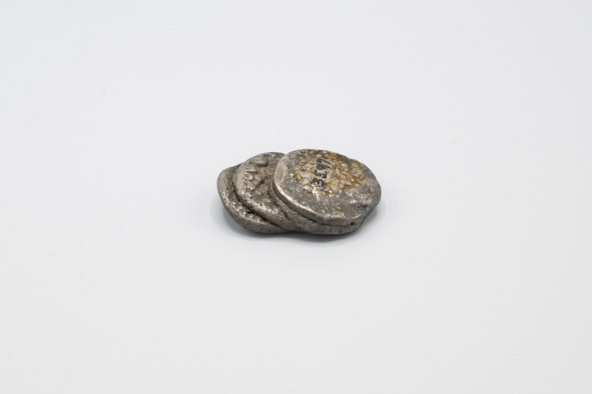 Image of Fifty cent pieces fused together from the Seattle Fire of 1889