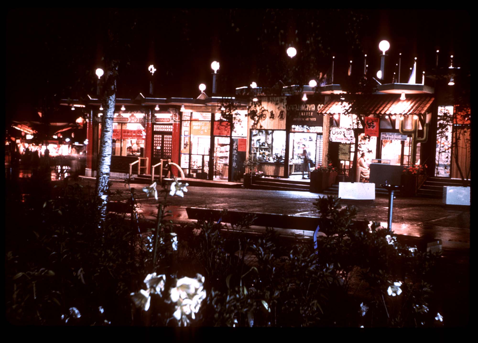 Image of Boulevard West at night, Boulevards of the World shopping area of the Seattle World's Fair, 1962