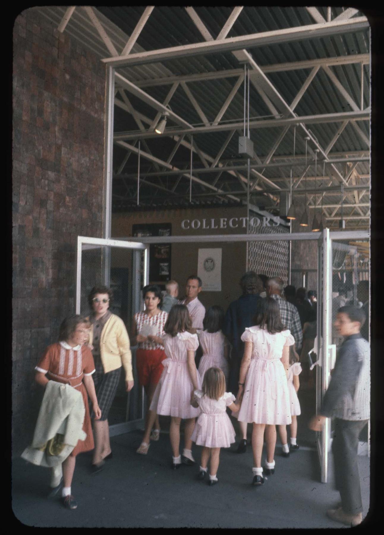 Image of A group of young girls entering a building at the Seattle World's Fair, 1962