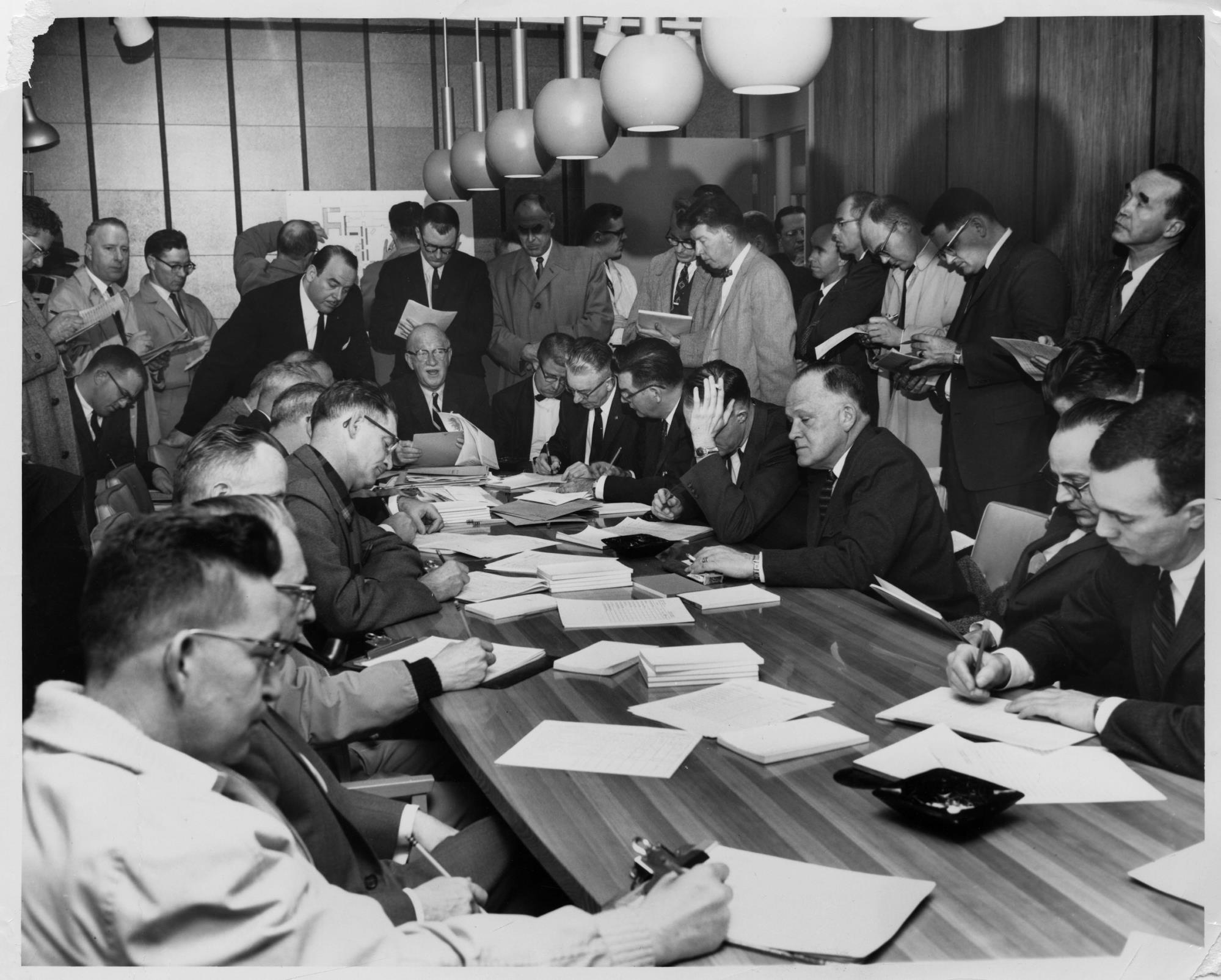 Image of Washington State Coliseum construction bidding meeting, Seattle World's Fair, circa 1959