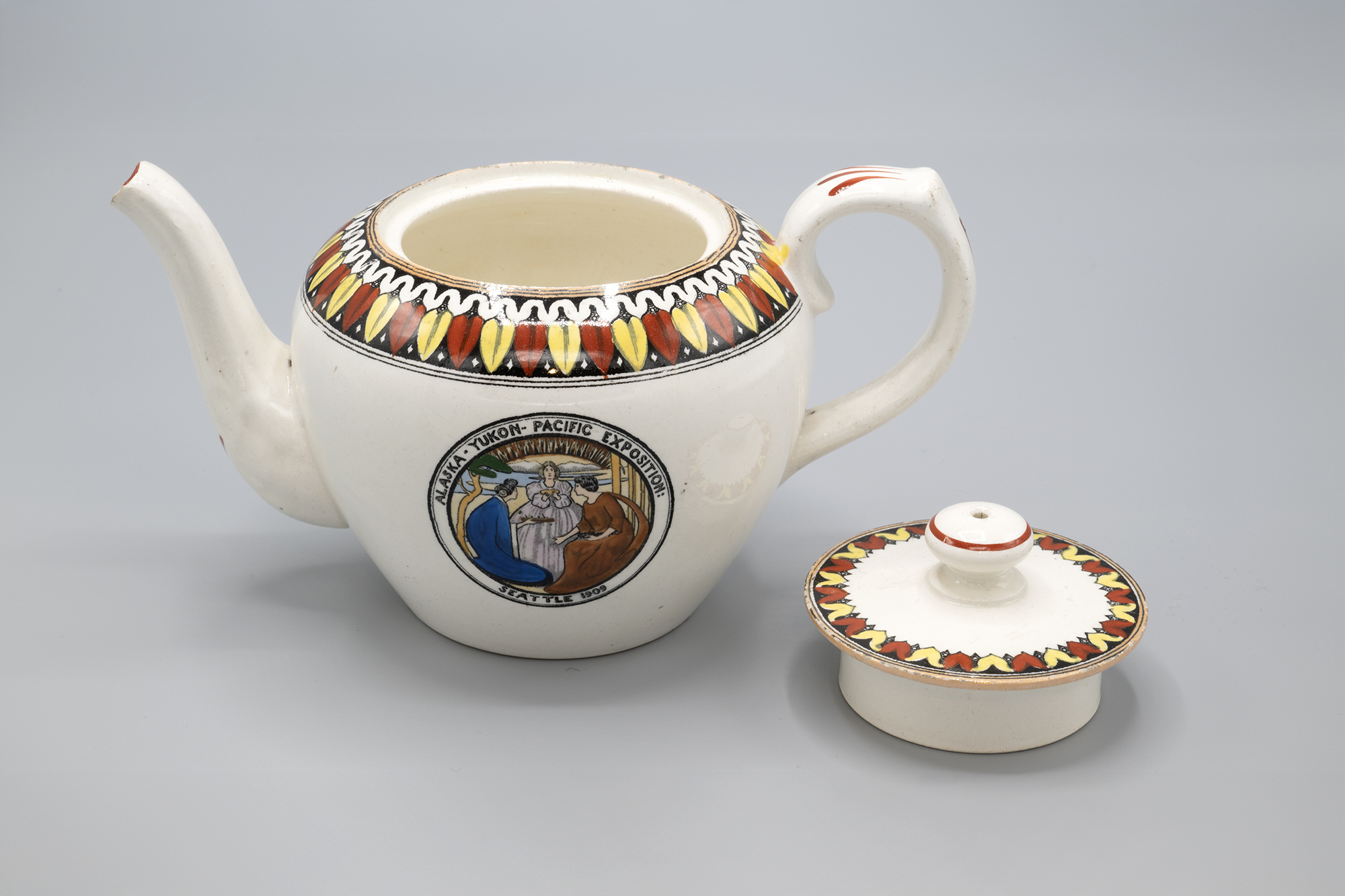 Image of Alaska-Yukon-Pacific Exposition (AYPE) souvenir teapot made for The Bon Marché, 1909