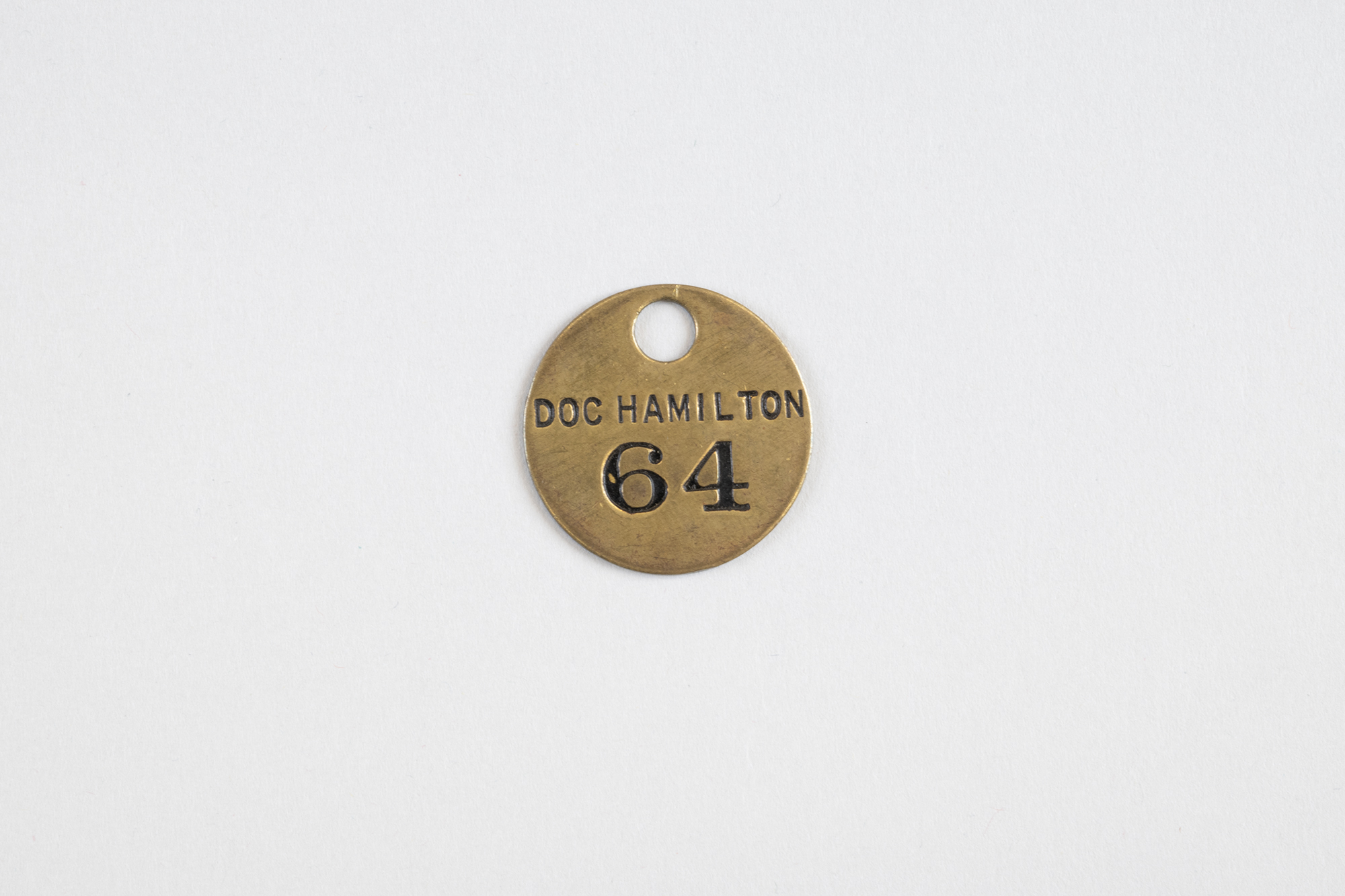 Image of Hat check tag from Doc Hamilton’s resataurant, ca. 1926-1932