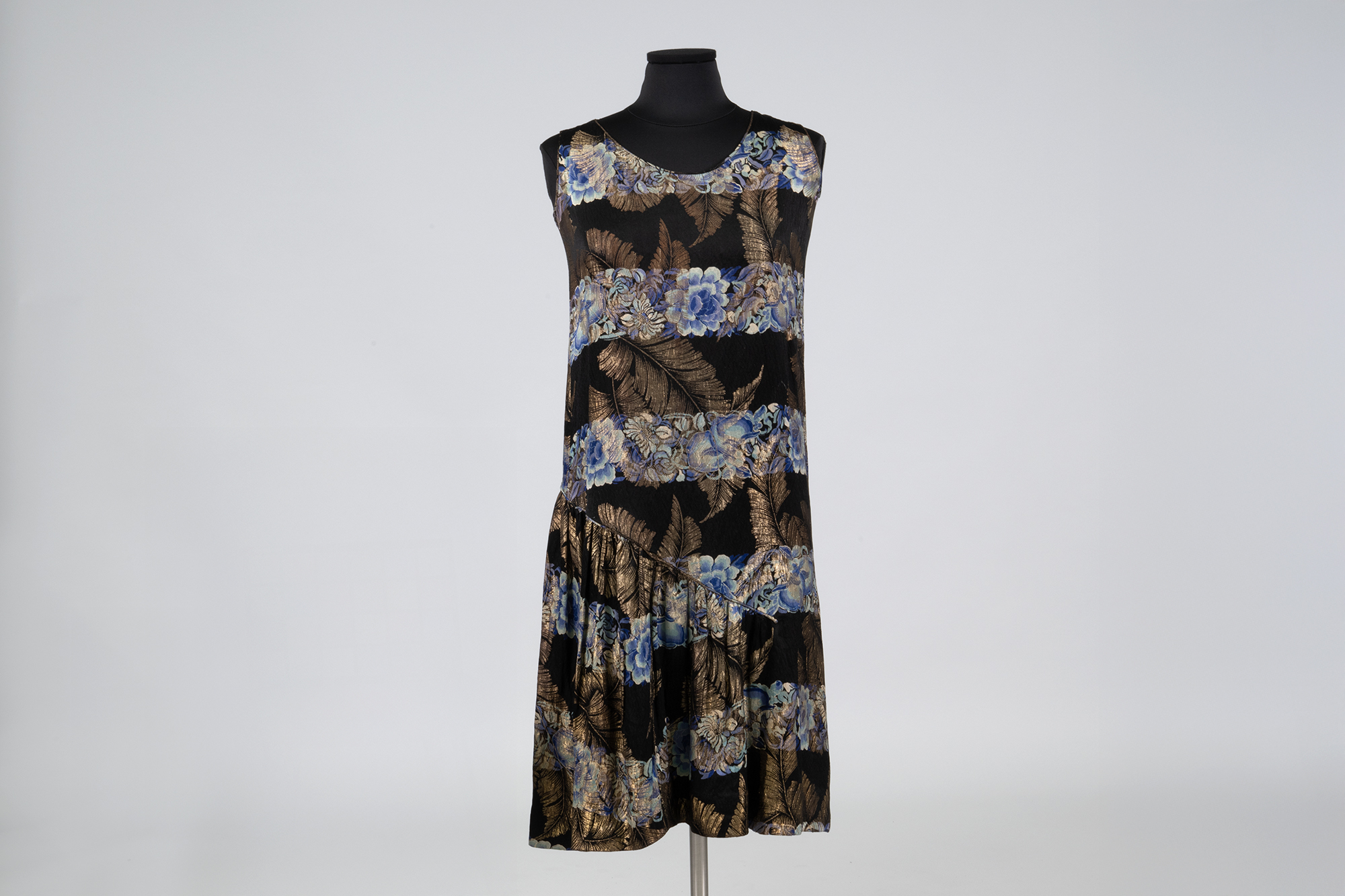 Image of Black dress with metallic floral pattern sold by Helen Igoe, ca. 1929