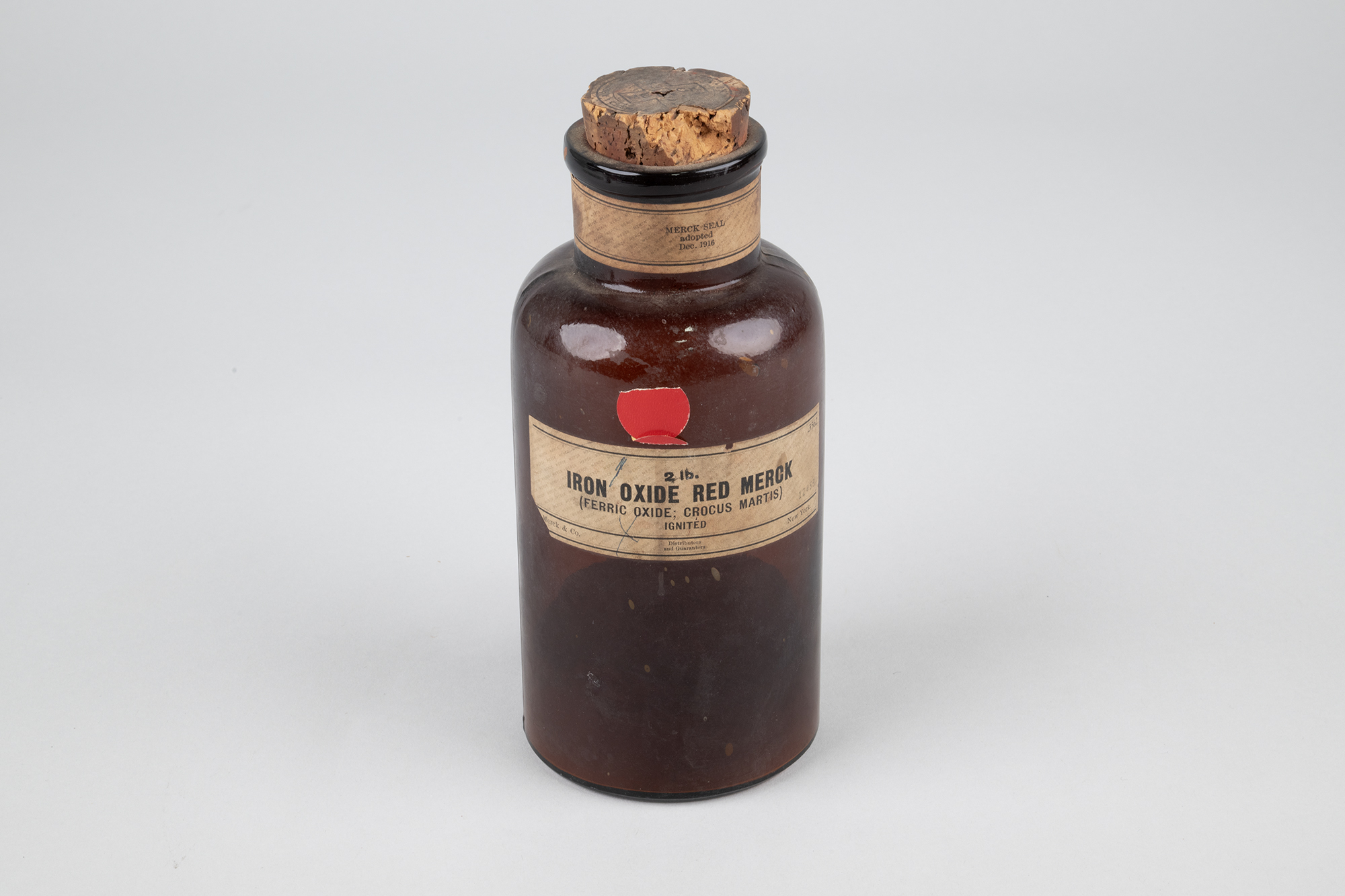 Image of Iron Oxide Red Merck apothecary bottle, one of many in a collection from Seattle Community College, ca. 1900