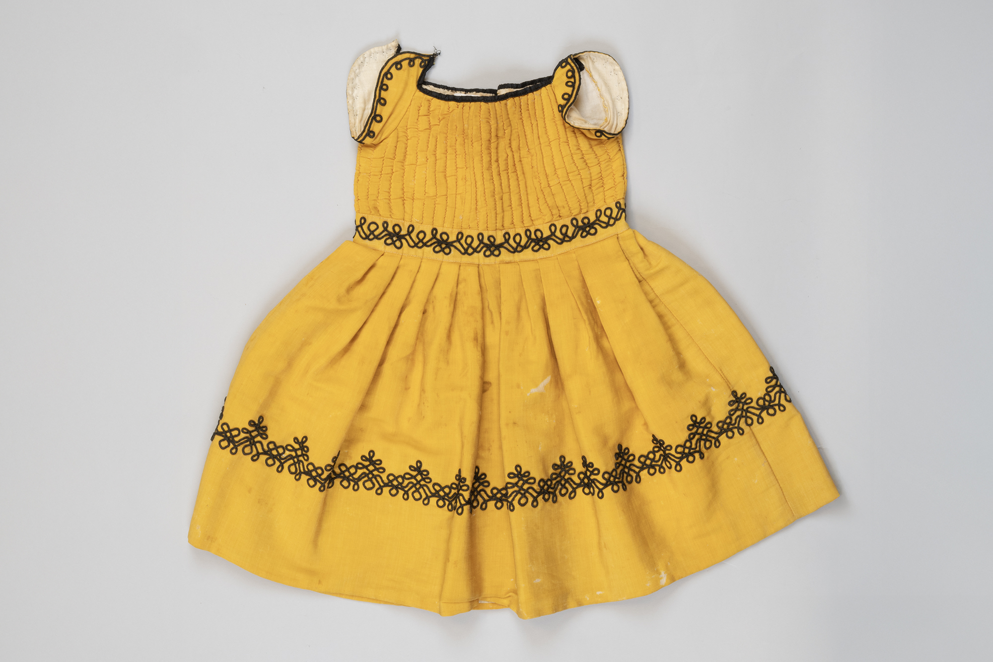 Image of Boy's mustard yellow dress, ca. 1875