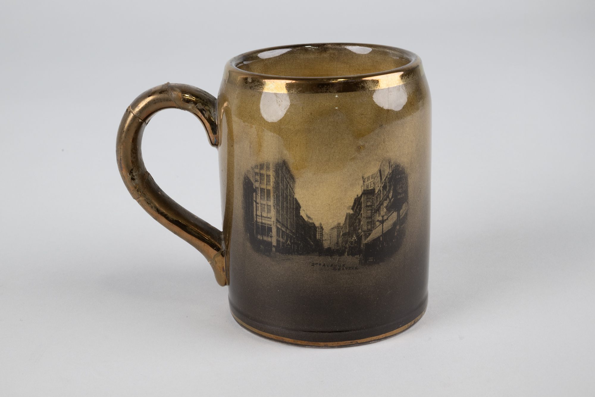 Image of Souvenir mug with picture of Mt. Rainier and 2nd Avenue, 1895