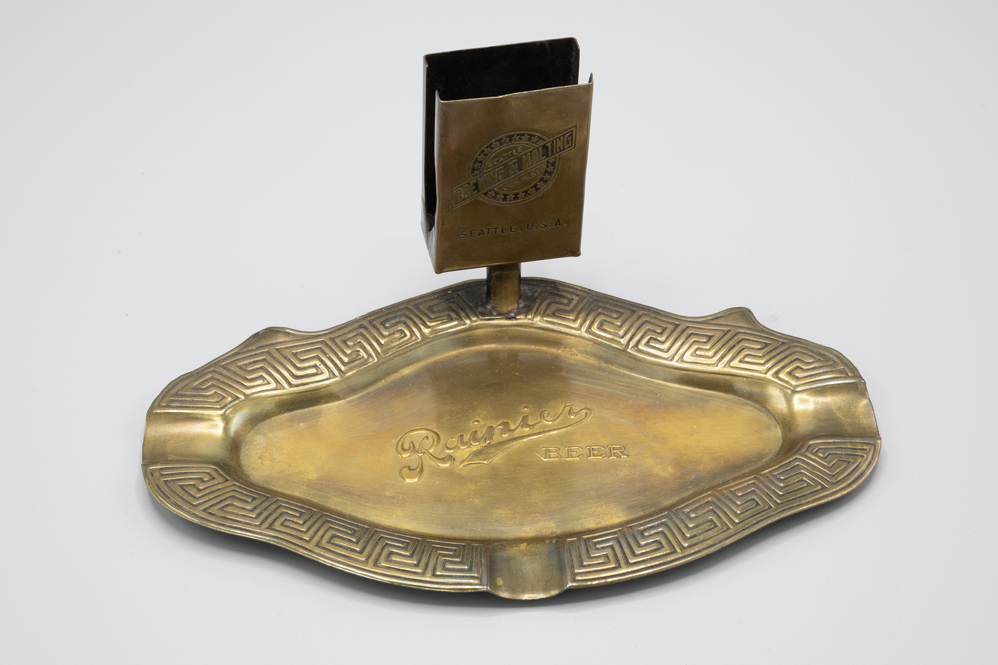 Image of Ash tray advertising Rainier Beer from Seattle Brewing and Malting Company, ca. 1900