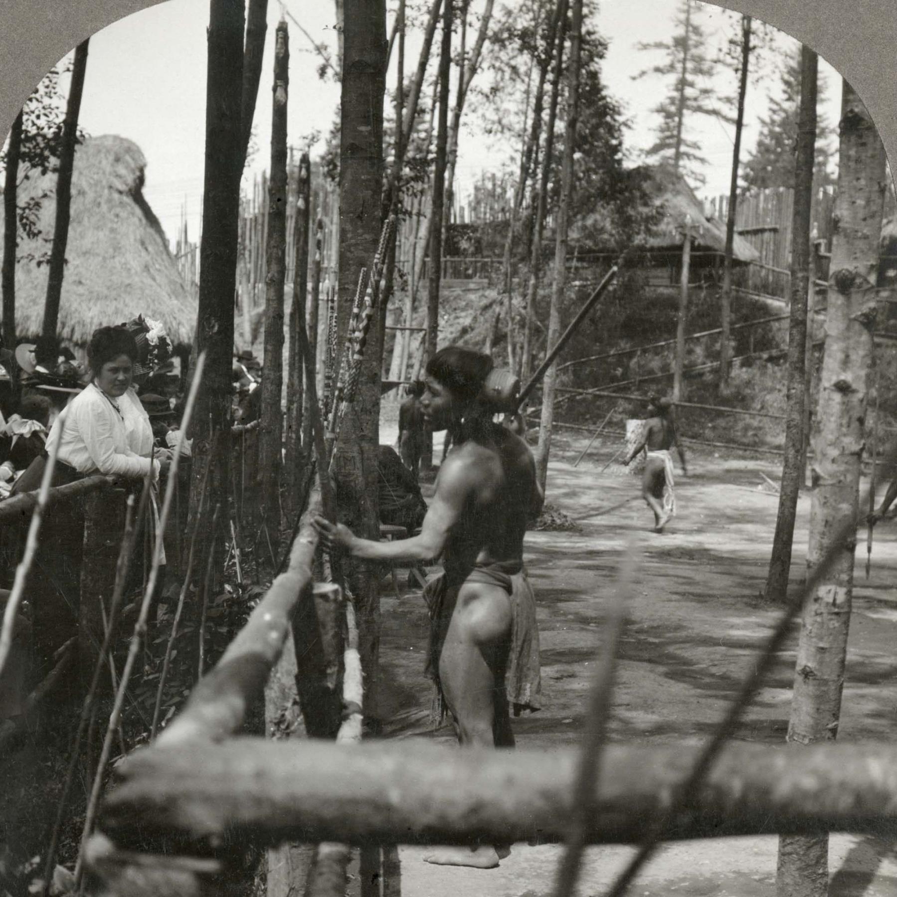 Image of Visitor at Igorrote Village at Alaska-Yukon-Pacific Exposition, Seattle, 1909