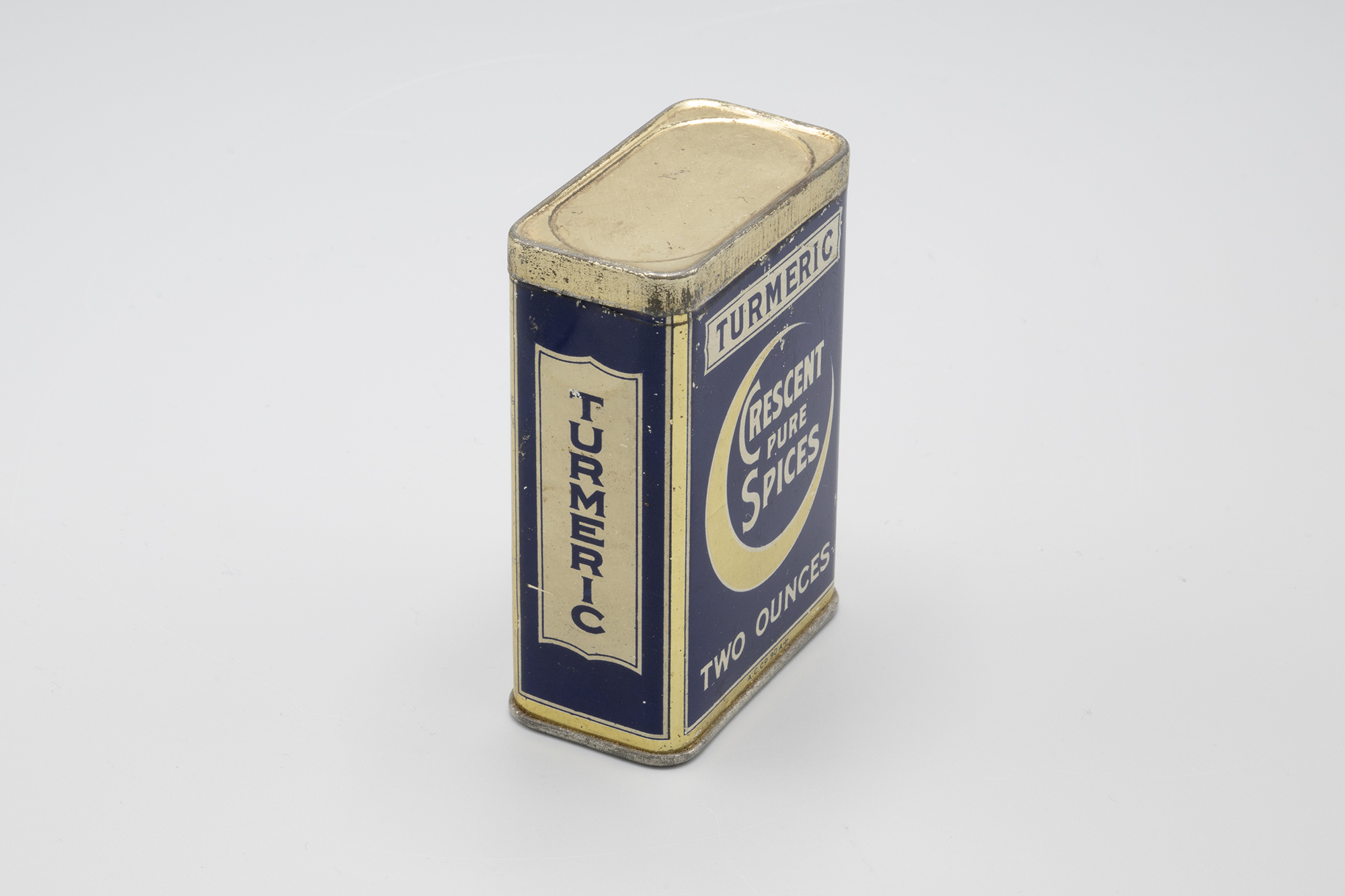 Image of Tin for turmeric from Crescent Pure Spices, ca. 1910