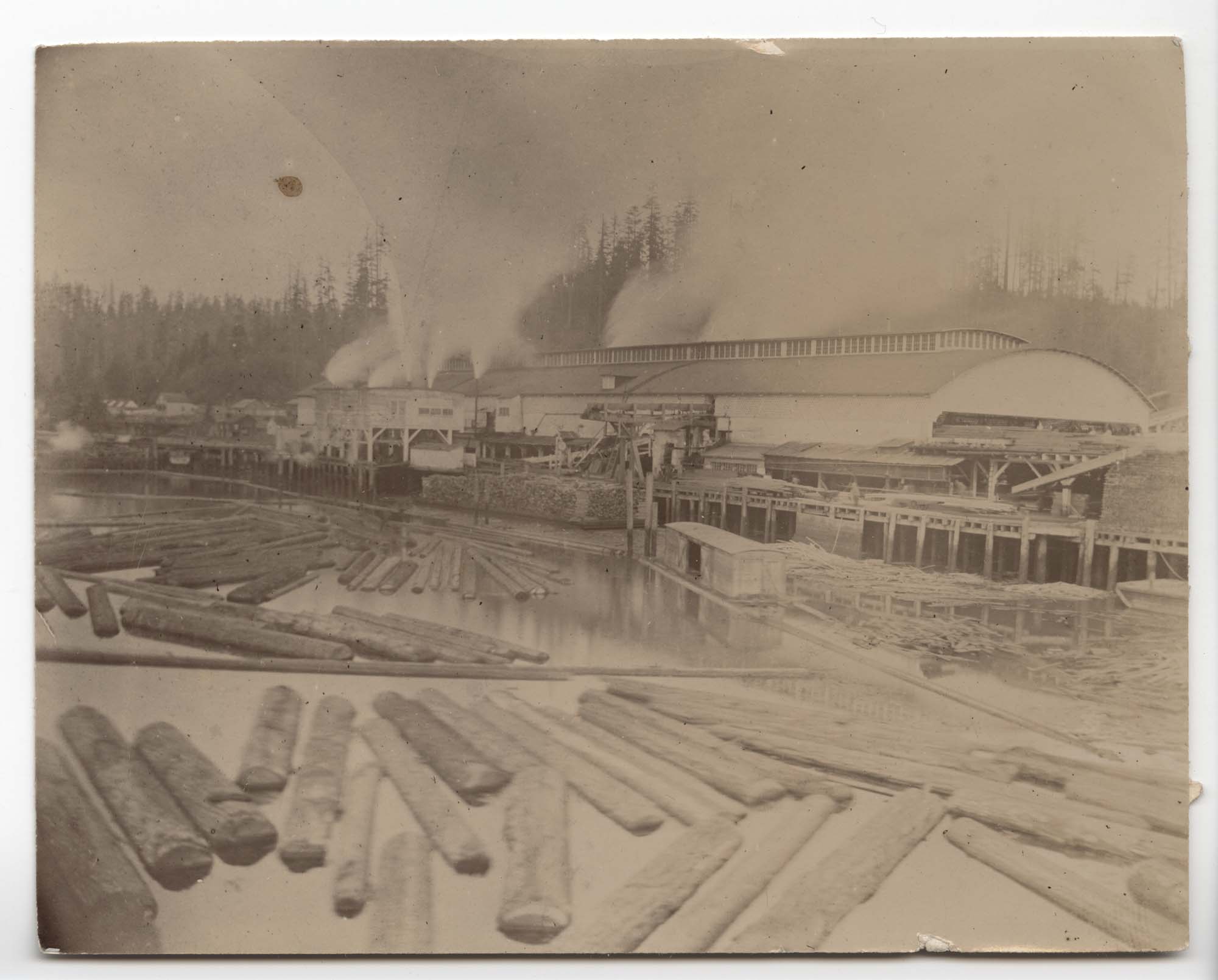 Image of Second Port Blakely Mill with log pond in foreground, circa 1895