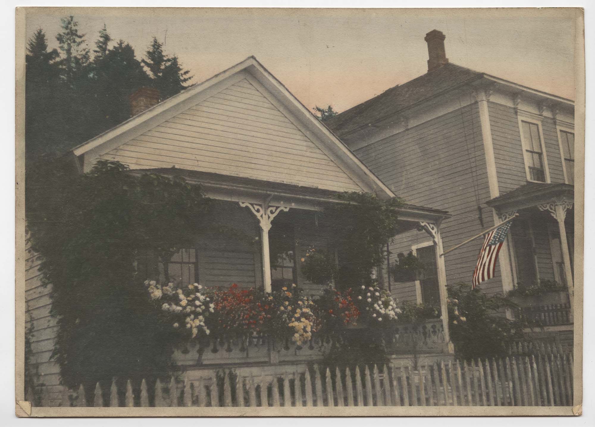 Image of Mill company house at Port Blakely with flowers on porch, circa 1900