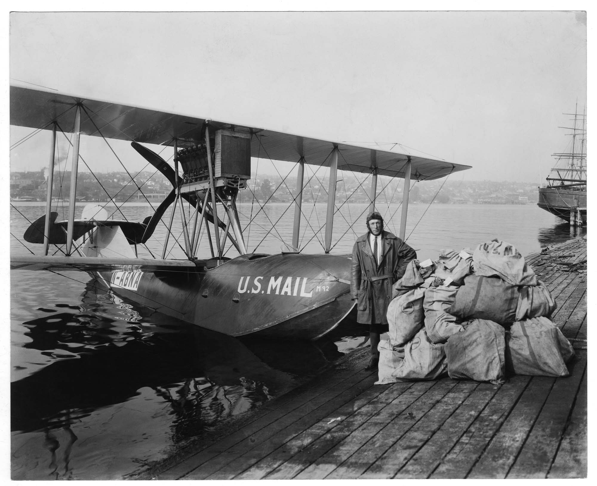 Image of Pilot Eddie Hubbard with Boeing B-1 mail plane at Lake Union, circa 1925