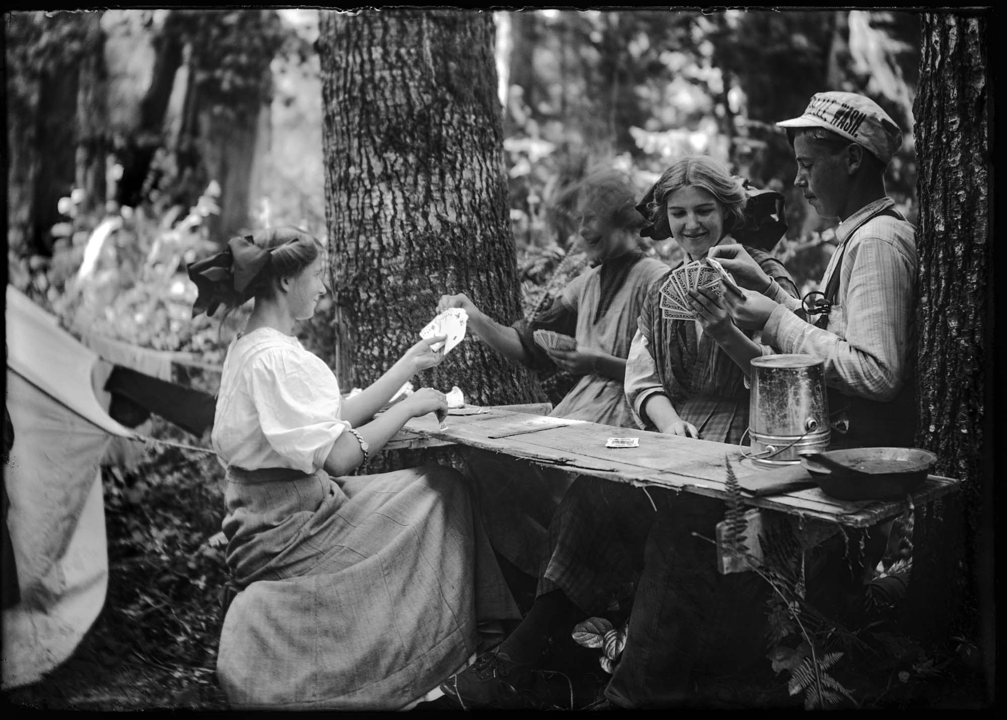 Image of Card game in the woods, Port Madison, circa 1910