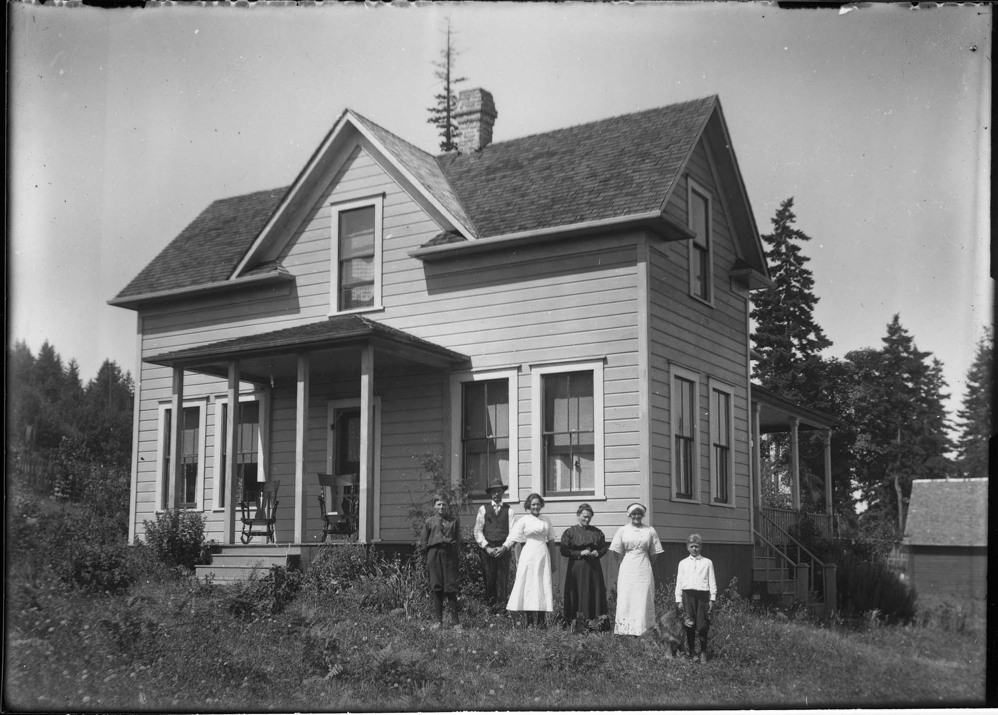 Image of Family in front of their house, probably in Seattle, circa 1910