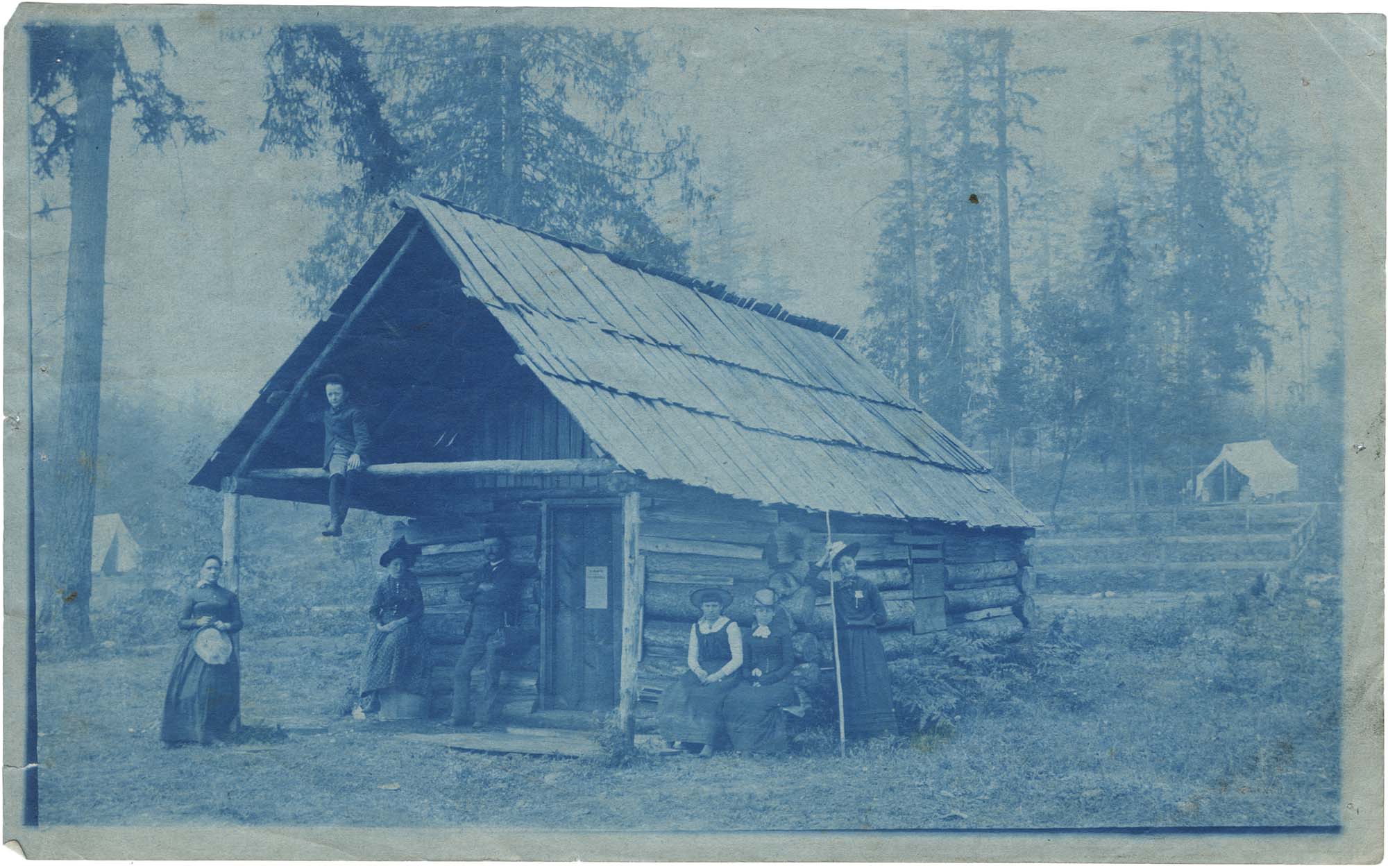 Image of Campbells and others at Chautauqua log cabin, 1890