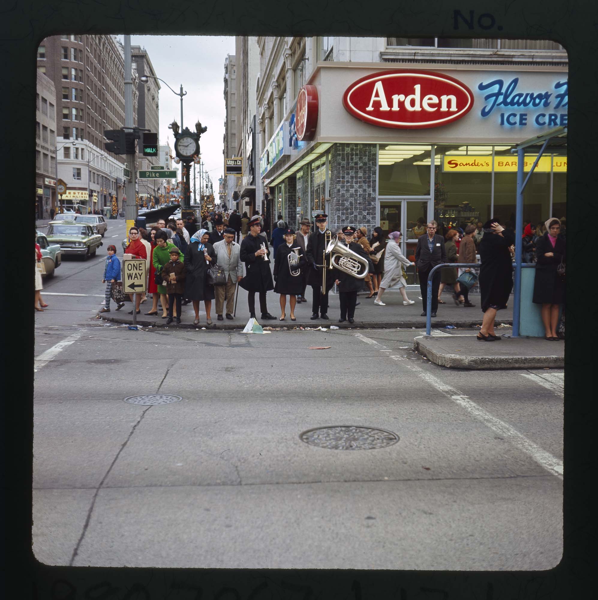 Image of People waiting to cross Pike Street at Fourth Ave., Seattle, 1967
