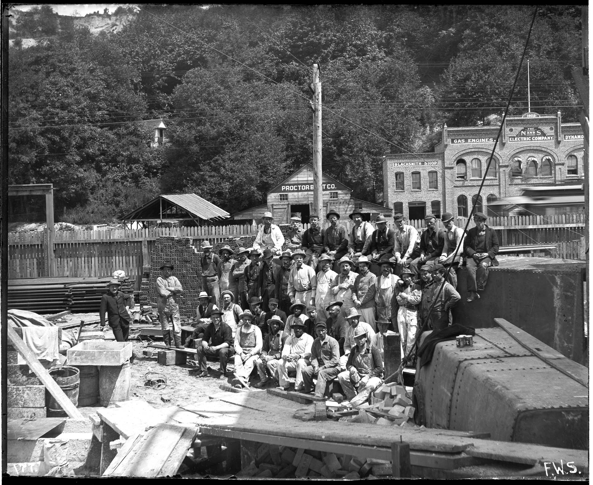 Image of Workers in yard across from the N and S Electric Company, Seattle, circa 1903
