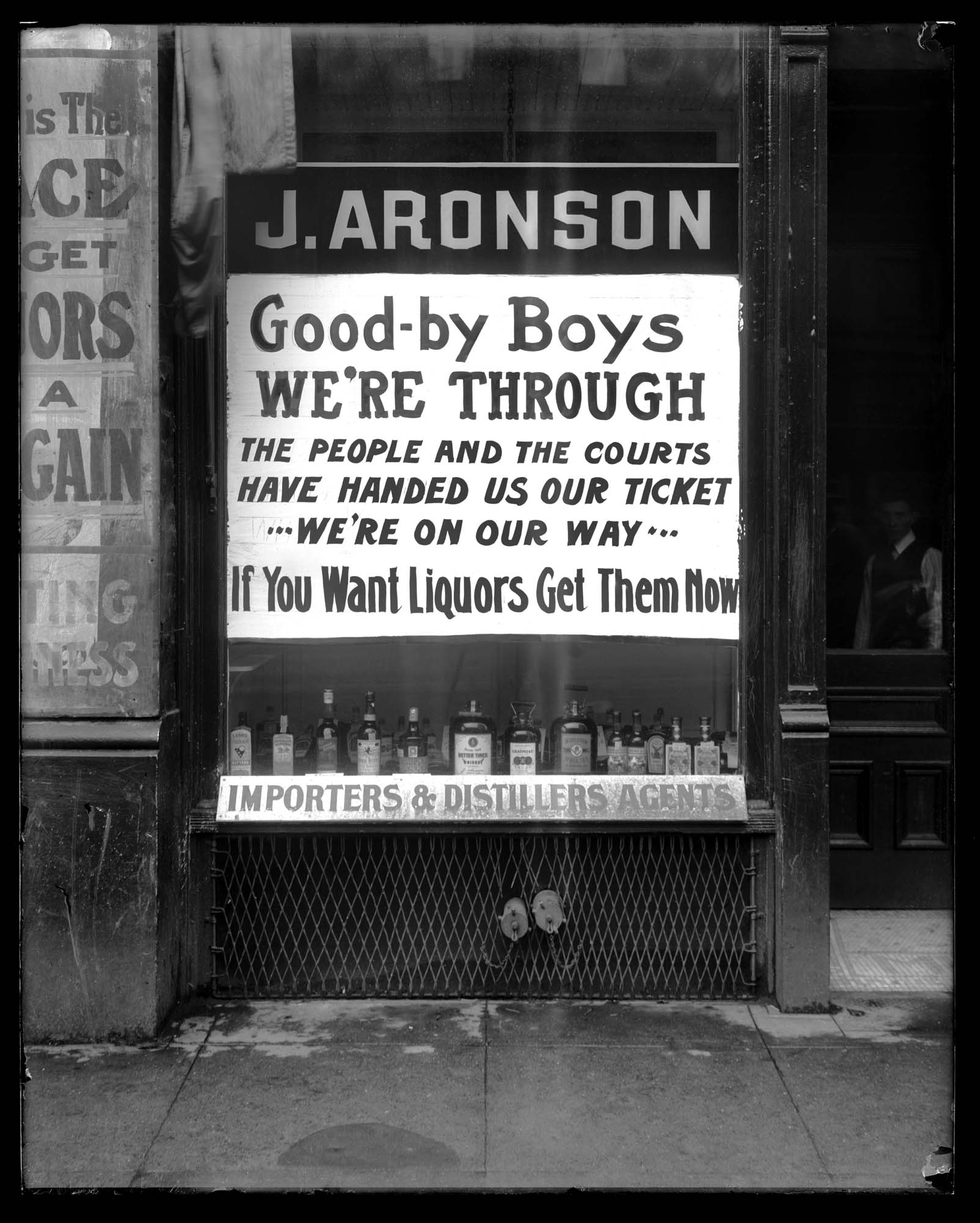 Image of J. Aronson Liquor sign at start of Prohibition, Seattle, circa 1916