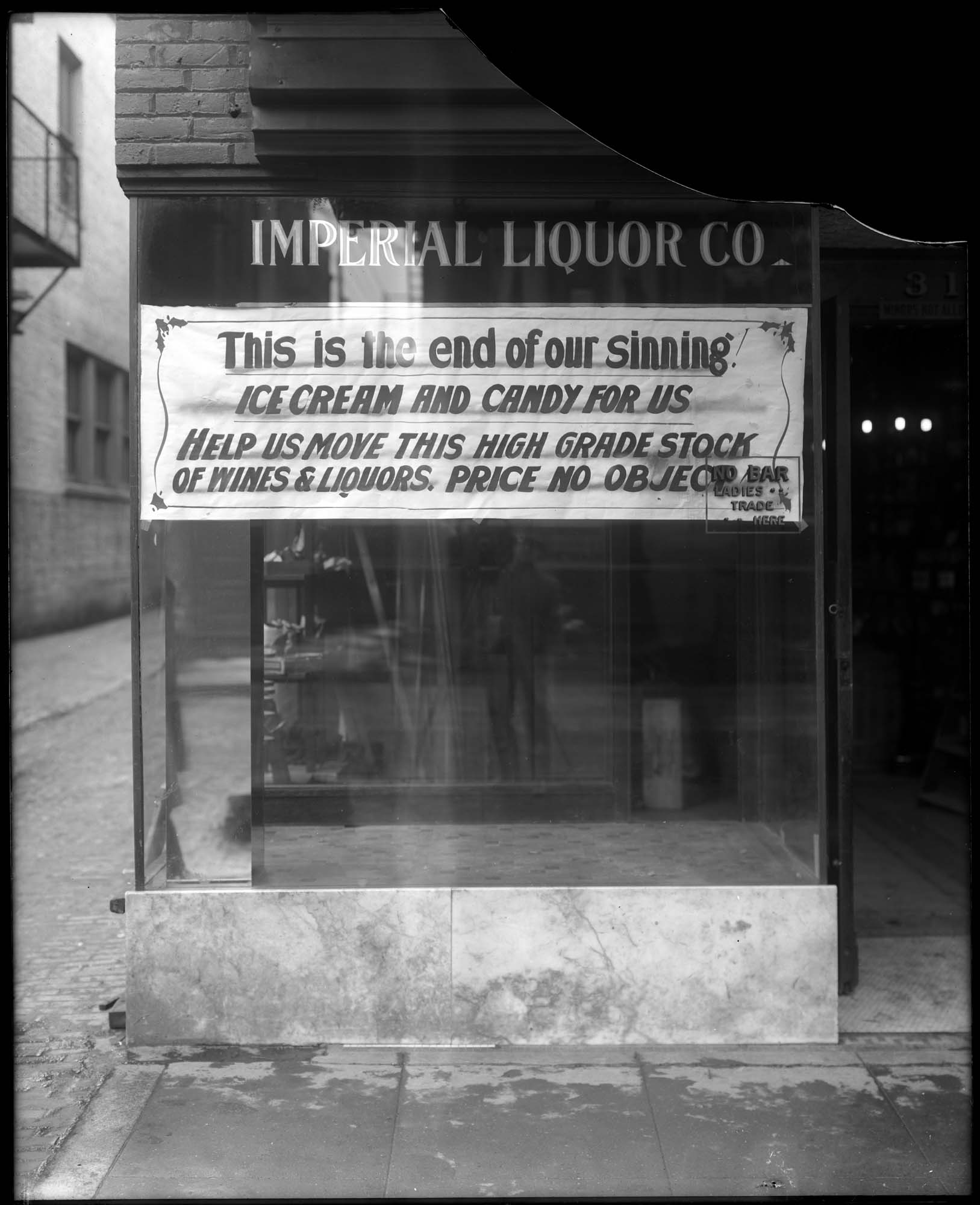Image of Imperial Liquor Co. sign at start of Prohibition, Seattle, circa 1916