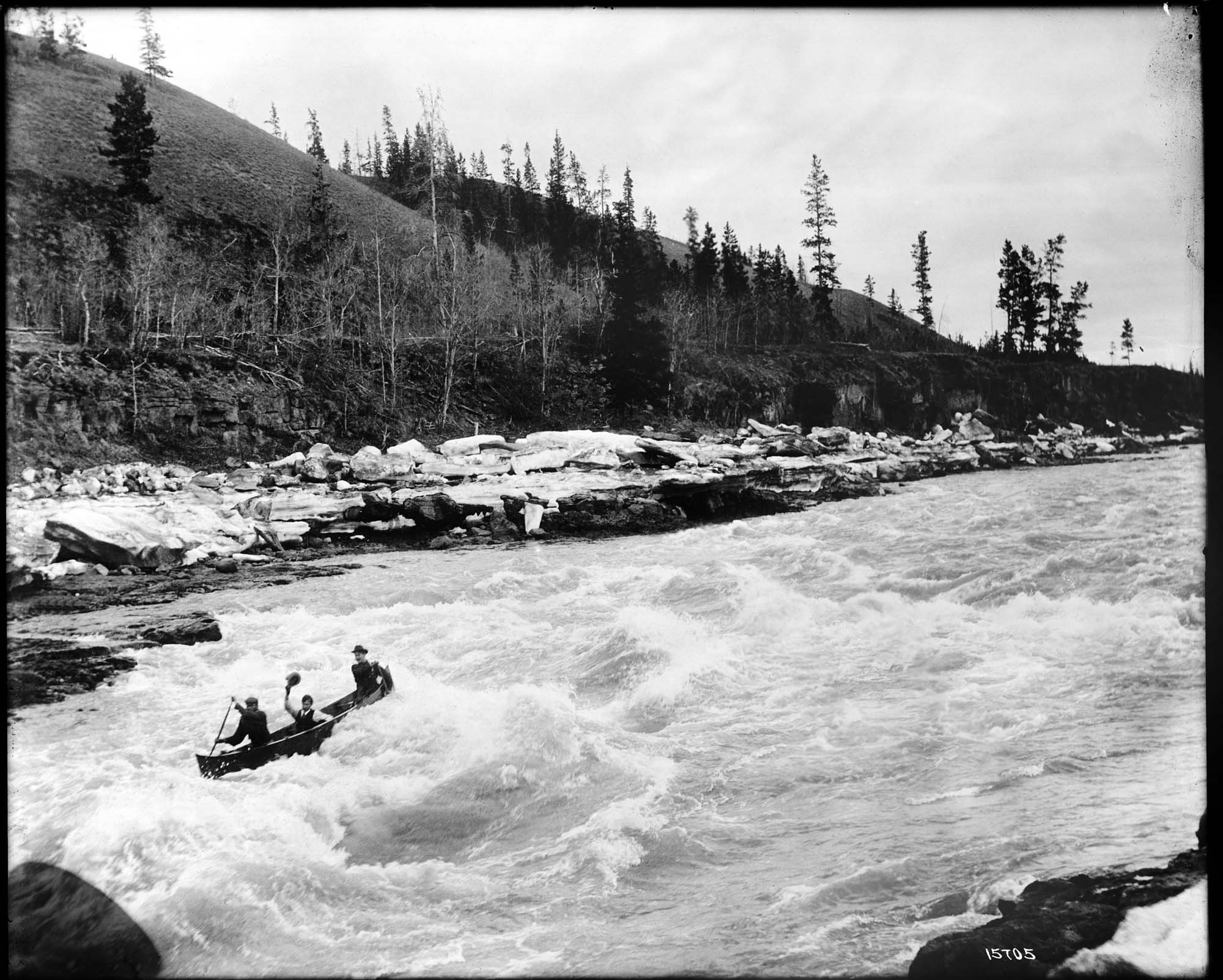 Image of Shooting White Horse Rapids in a canoe, 1905