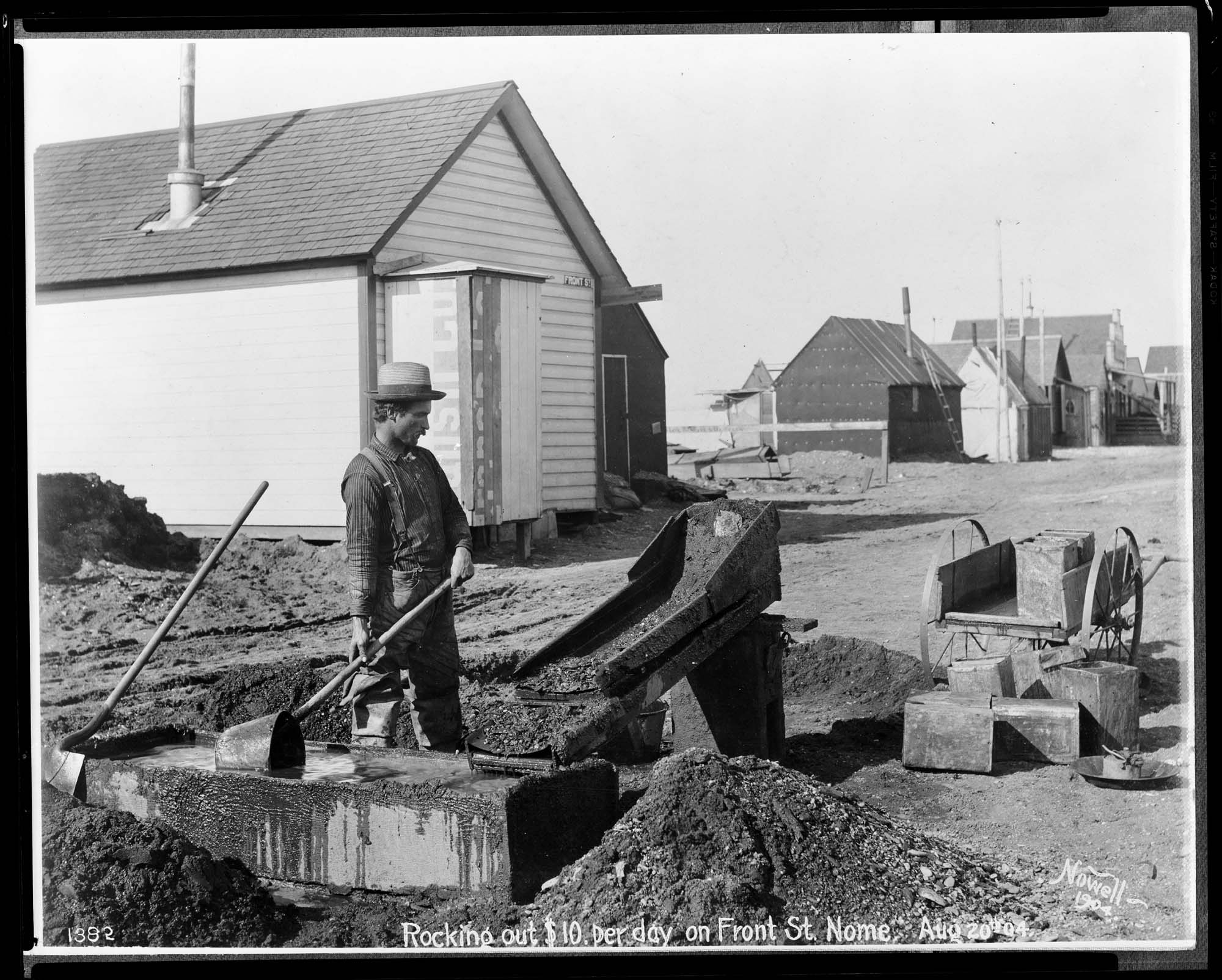 Image of Prospector operating a rocker, Nome, 1904