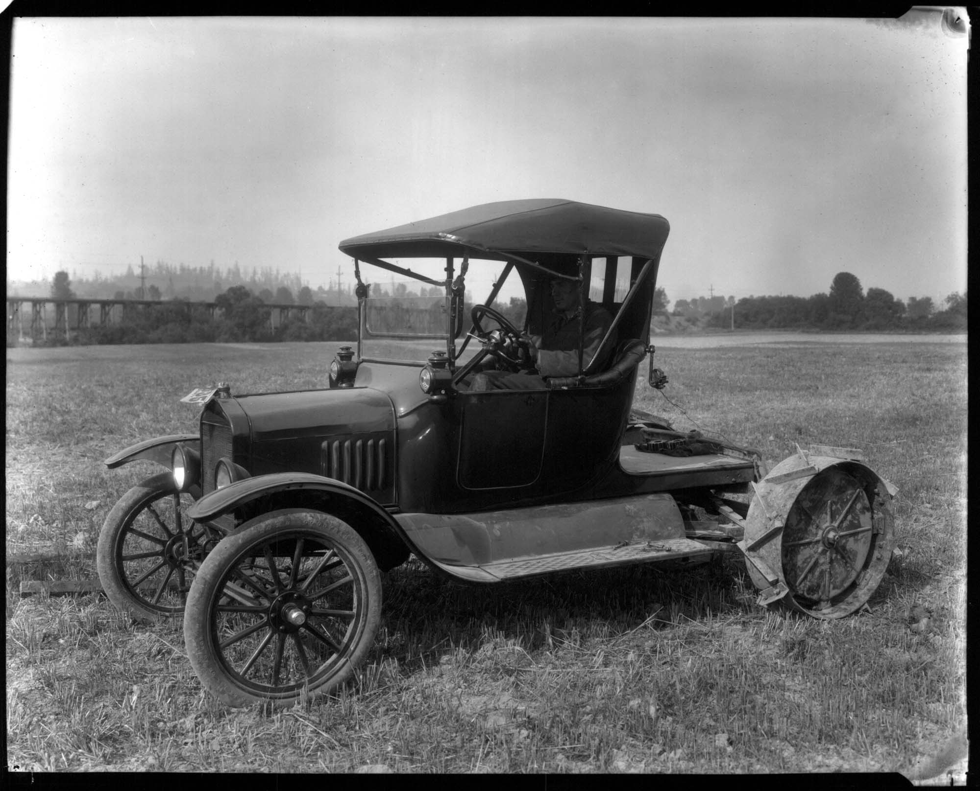 Image of Model T Ford adapted to be a tractor, circa 1919