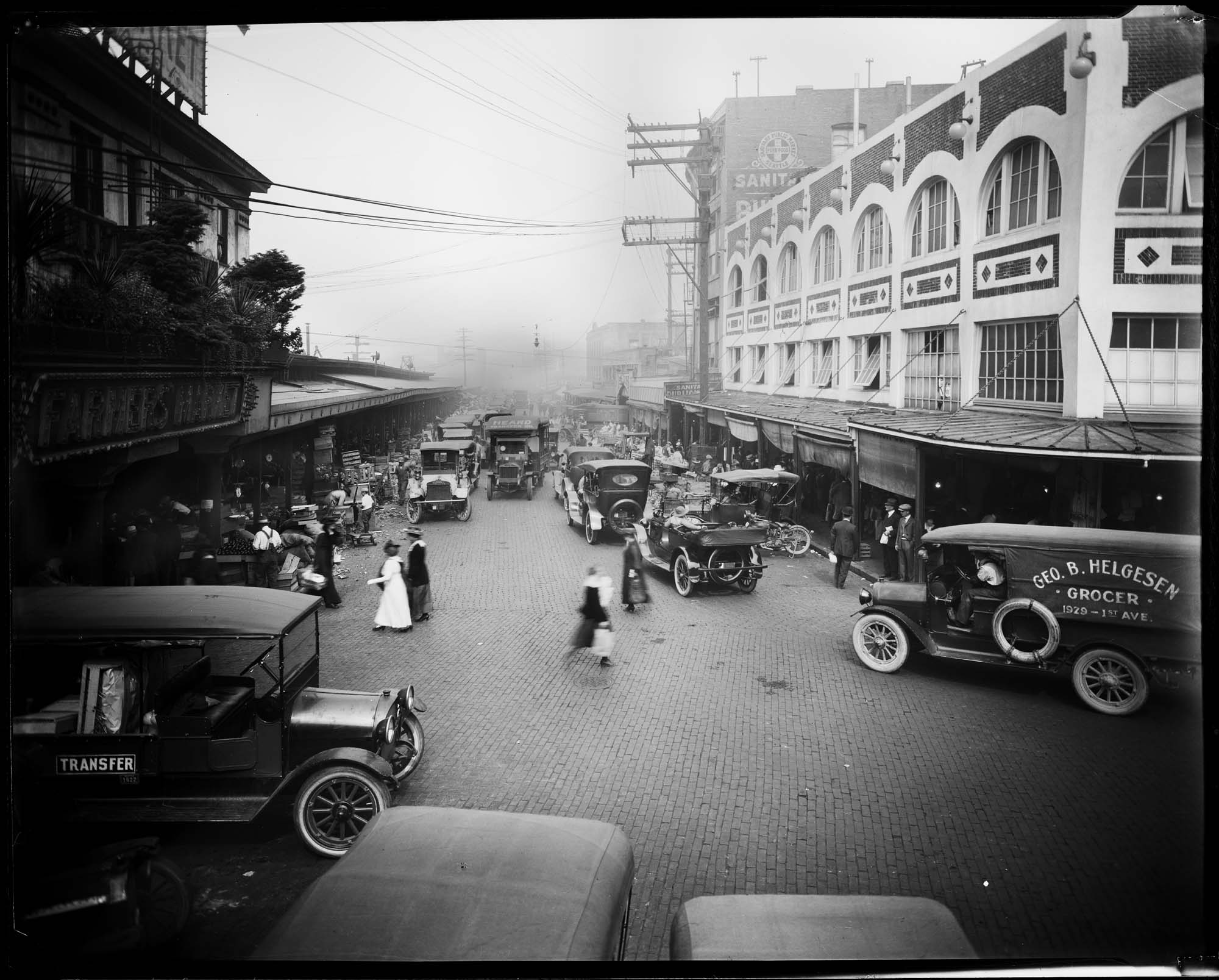 Image of Pike Place Market with trucks and cars, 1920