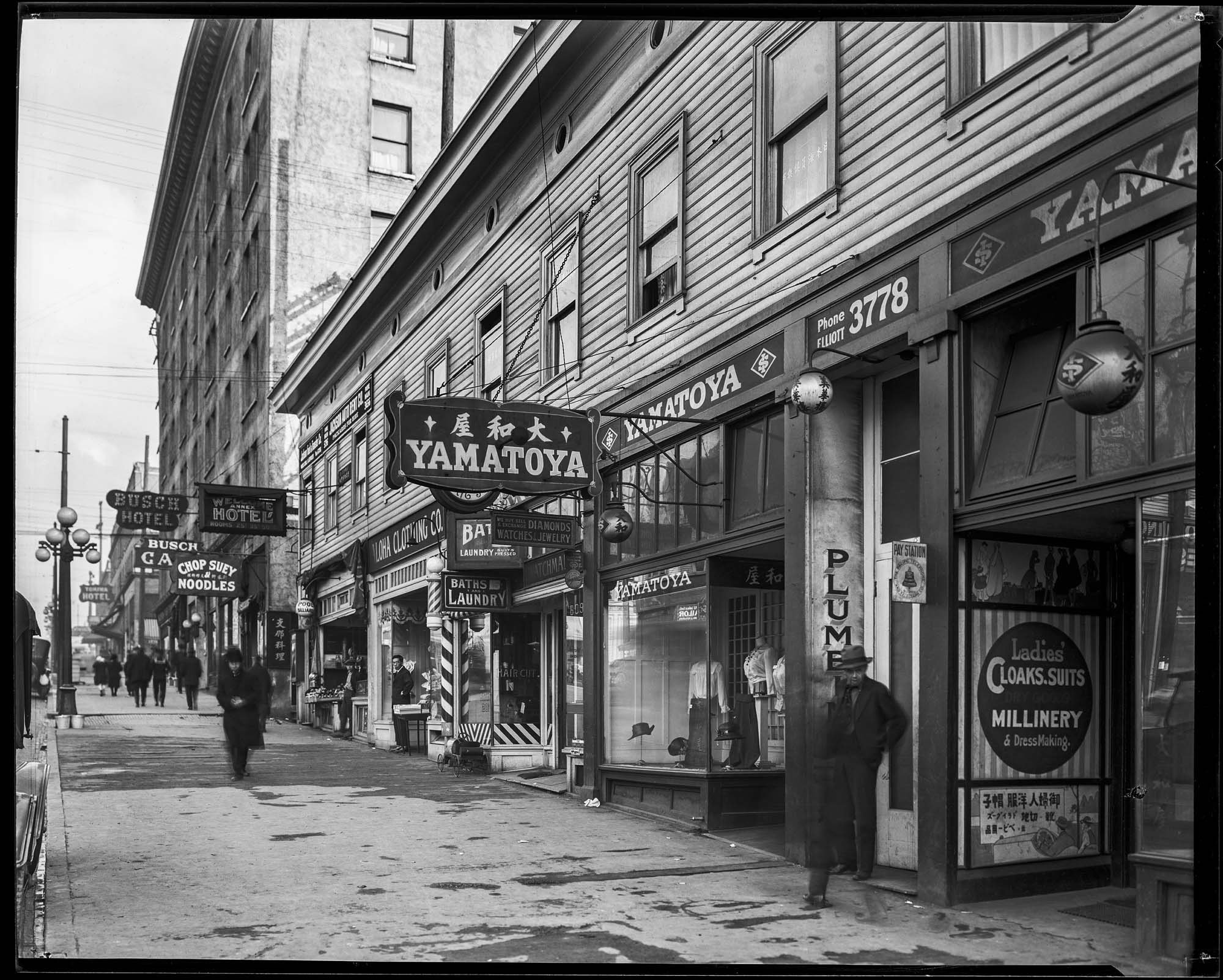 Image of Japanese clothing store and other Jackson Street businesses , circa 1919