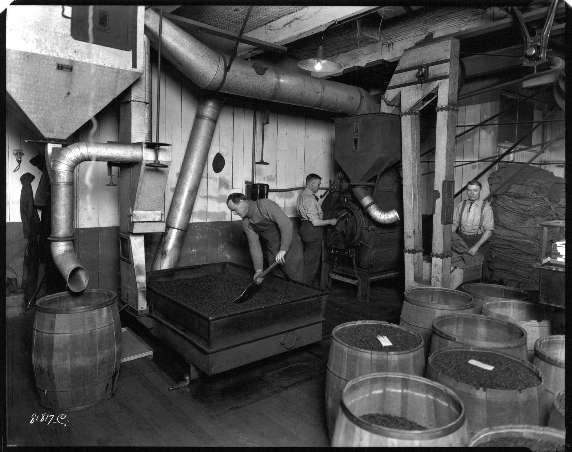 Image of Men working at Manning's coffee roasting plant, Seattle, circa 1920