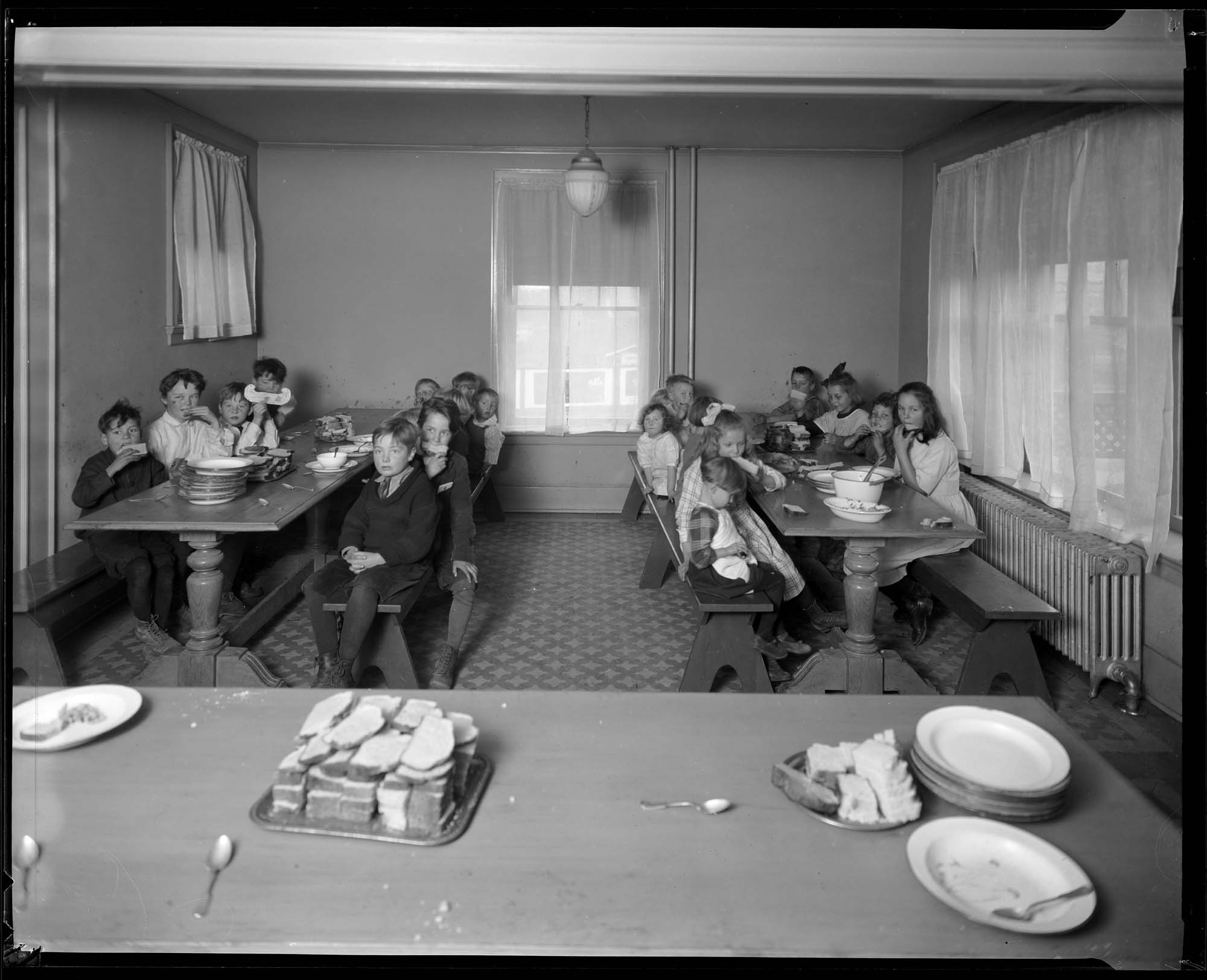 Image of Children eating a meal at Ryther Child Home, circa 1921