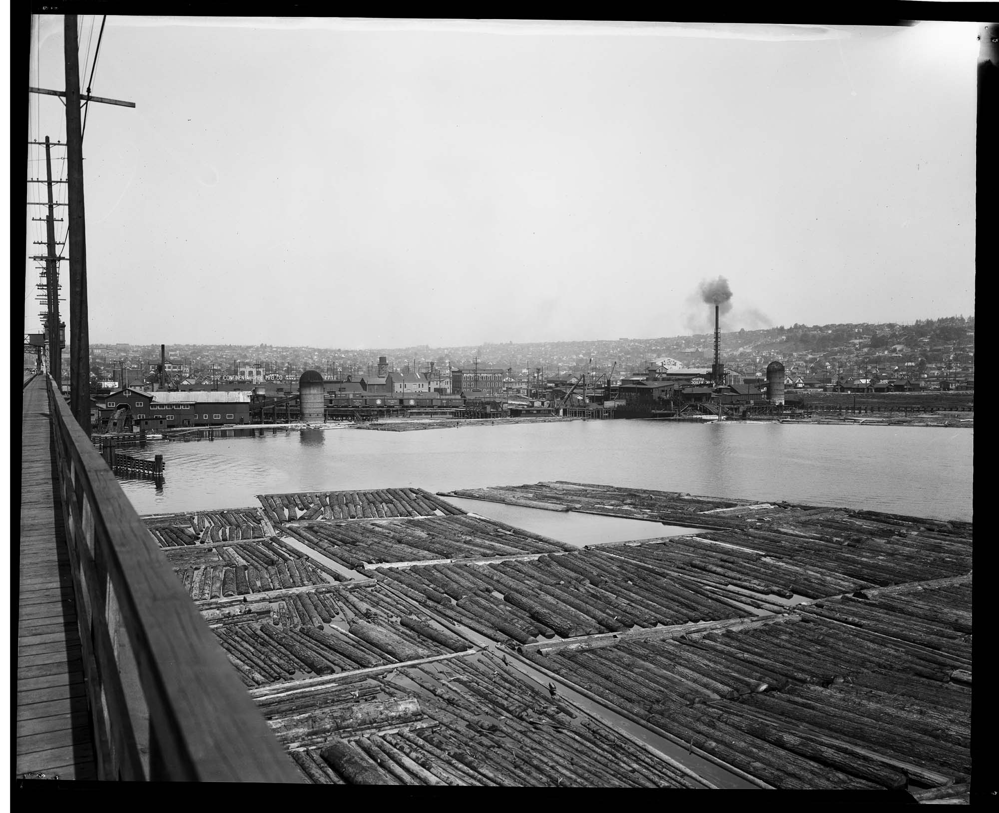 Image of Log rafts near the Ballard Bridge, circa 1919